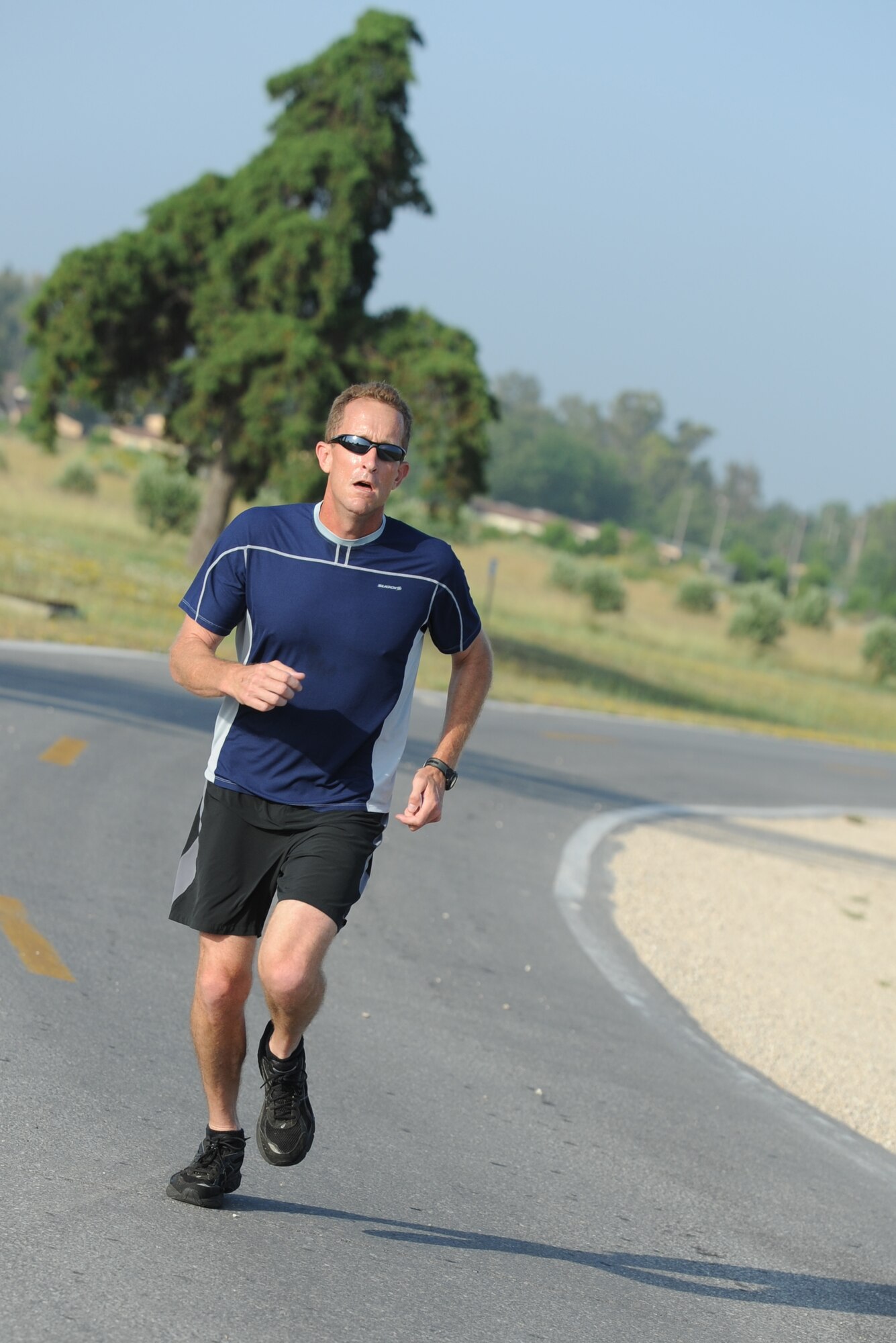 Lt. Col. Andy Stephan participates in the 5K Family Poker Run, June 11, 2011, at Incirlik Air Base, Turkey.  During the run, more than 50 participants stopped at five stations around the course where they received a playing card from a standard deck of cards, and the person with the best poker hand at the end was declared the winner.  (U.S. Air Force photo by Airman 1st Class Clayton Lenhardt/Released)