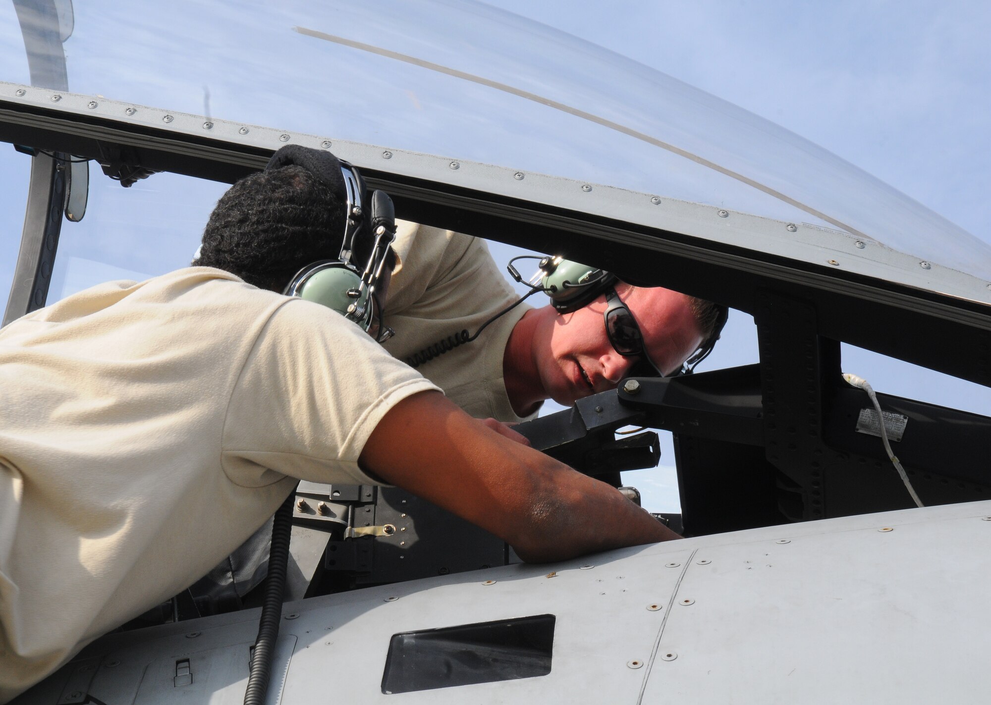 SPANGDAHLEM AIR BASE, Germany – Senior Airmen William Jones and Justin Vesely, 52nd Aircraft Maintenance Squadron aircraft electrical environment systems journeymen, troubleshoot the electrical system for a canopy on an A-10 Thunderbolt II here June 16. The 81st Aircraft Maintenance Unit maintain, service, inspect, launch and recover the A-10 Thunderbolt IIs flown by the 81st Fighter Squadron here. (U.S. Air Force photo/Airman 1st Class Dillon Davis)