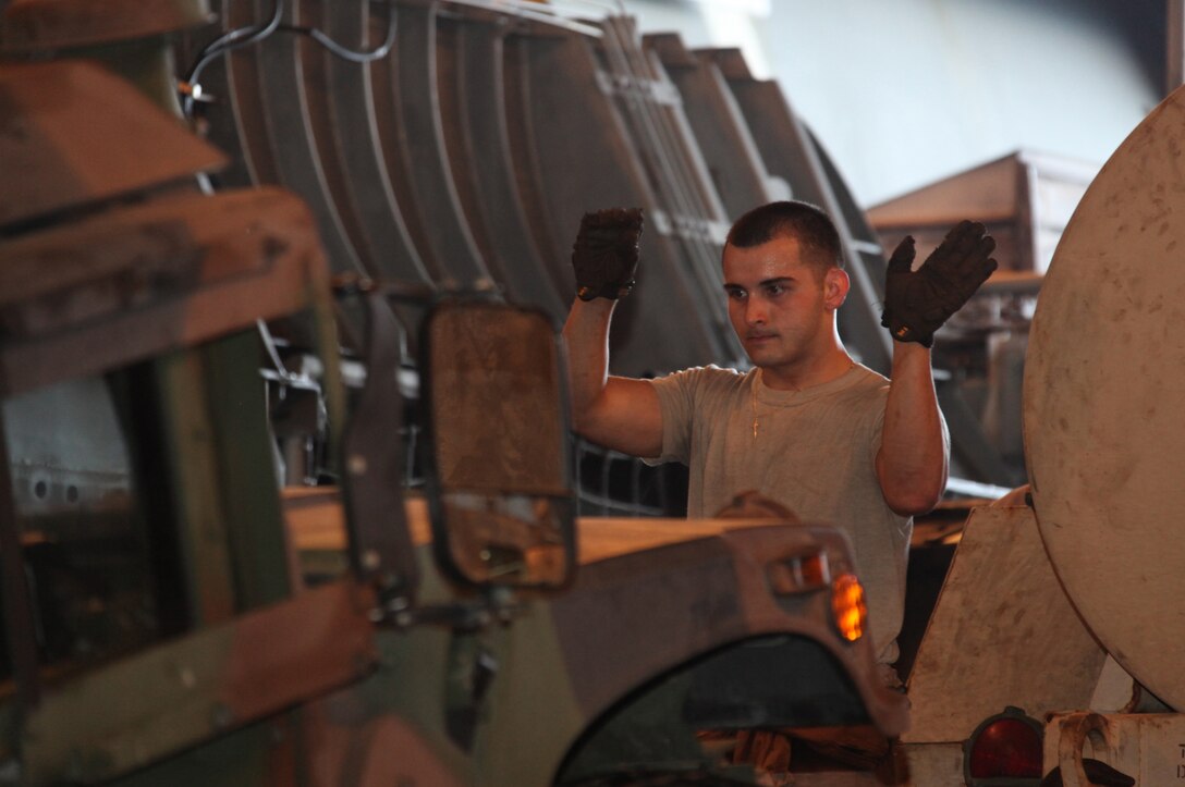 First Sgt. Michael P. Edwards pulls the lanyard on a 120mm mortar system, causing it to fire here June 21. Edwards, a Rome, N.Y., native, serves as the first sergeant for Battery K. The battery provides artillery and indirect fire for Battalion Landing Team 3/1, the ground-combat element of the 11th Marine Expeditionary Unit. The unit is training with the Expeditionary Fire Support System for an upcoming deployment later this year.
