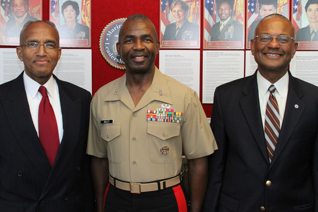 Retired Maj. Gen. Arnold Fields (left), Maj. Gen. Ronald Bailey, commanding general, Marine Corps Recruiting Command, and Dr. Kenneth Dunn, a retired Marine colonel, gather for a photo June 22 before a dinner with community leaders from the local area. Major Gen. Bailey was the guest speaker and he talked about the importance of good leadership, diversity and how the Marine Corps can impact communities.