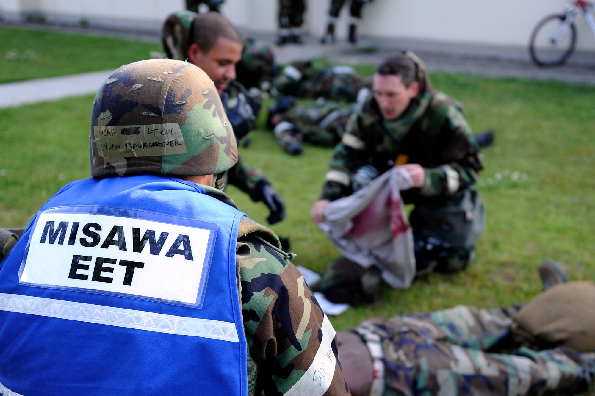 MISAWA AIR BASE, Japan -- A member of the exercise evaluation team watches as a scenario is executed during a training exercise June 22. Airmen are evaluated on their response to various training injects from EET members. (U.S. Air Force photo/Staff Sgt. Marie Brown/Released)