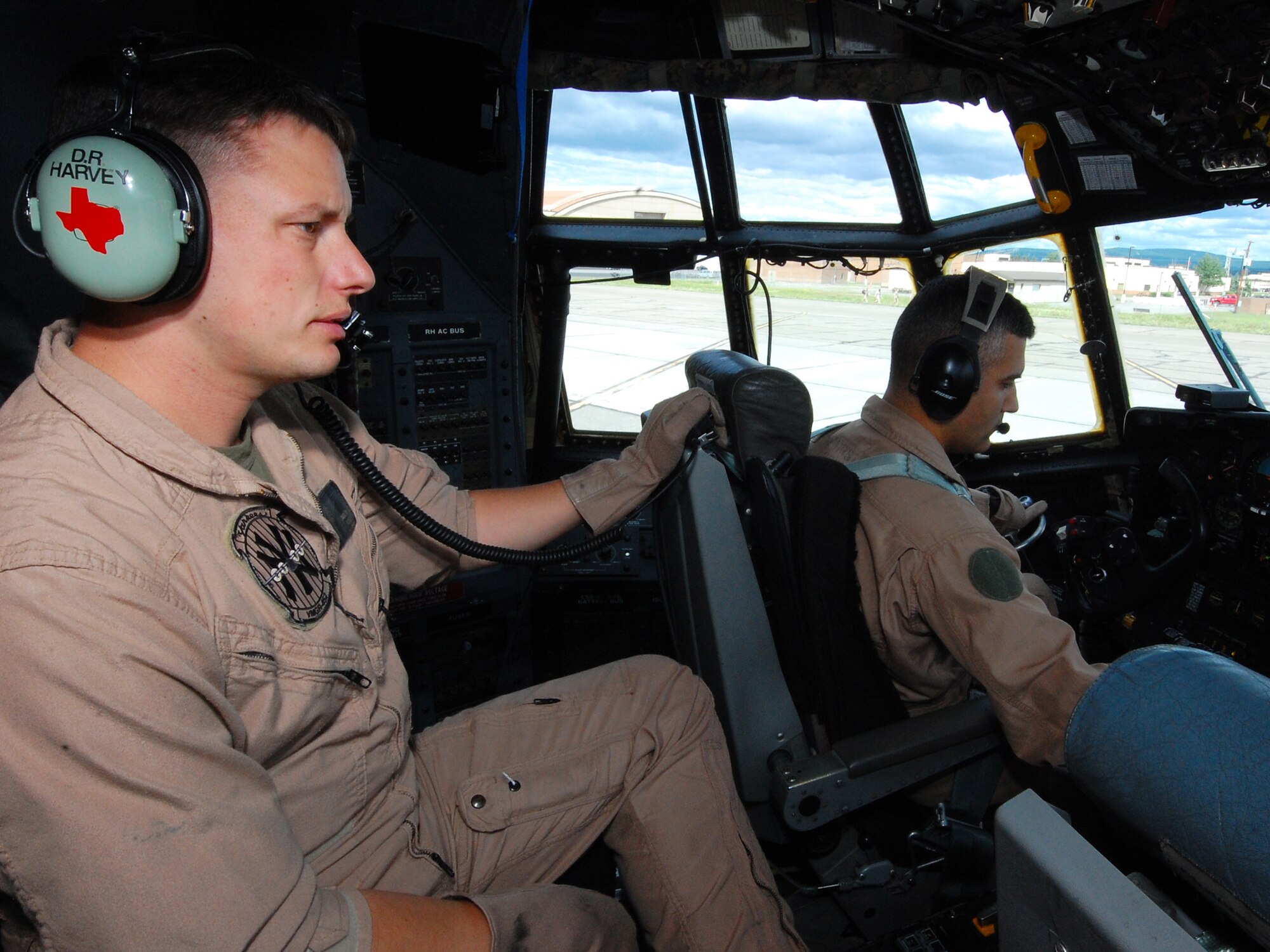 (From left to right) U.S. Marine Corps Sgt. Dustin Harvey, a flight engineer, and Capt. Kenneth Furst, a KC-130 Hercules pilot, both with the Marine Aerial Transport Squadron (VMGR) 452, Stewart Air National Guard Base, N.Y., conduct pre-flight inspections before heading out for an in-flight refueling mission during the Northern Edge Premier Joint Training Exercise at the Joint Pacific Alaska Range Complex, June 21. More than 1,000 personnel have been deployed to Alaska for the exercise, which is taking place at the northern most Alaskan Army and Air Force installations.  (U.S. Air Force photo/Staff Sgt. Lakisha A. Croley)