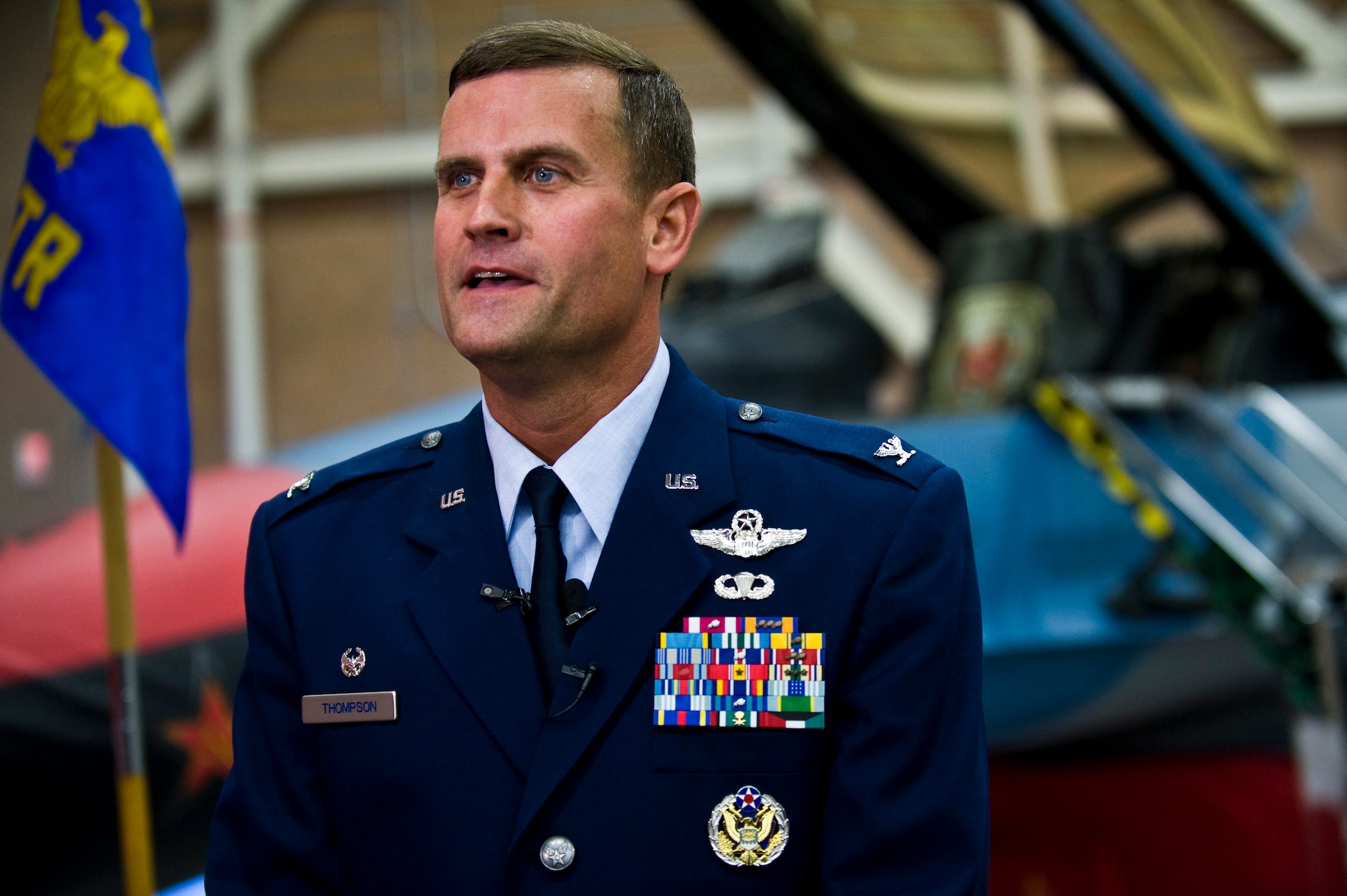 U.S. Air Force Col. Kenneth Thompson, Nevada Test and Training Range commander, speaks with the media about the challenges he expects as the organization's new commander following a ceremony re-designating the 98th Range Wing as the NTTR at Nellis Air Force Base, Nev., June 21, 2011.  Like the 98 RANW, The NTTR will remain a direct reporting unit to the U.S. Air Force Warfare Center and continue to operate, maintain and manage the 2.9-million-acre range (42 percent of the land managed by the U.S. Air Force) and 12,000 square miles of military airspace. More than 1,000 military, civilian and contract personnel are assigned to the organization. Prior to assuming command of the NTTR, Colonel Thompson served as the defense and air attaché to the U.S. Embassy in Cairo. (U.S. Air Force photo by Senior Airman Brett Clashman/Released)