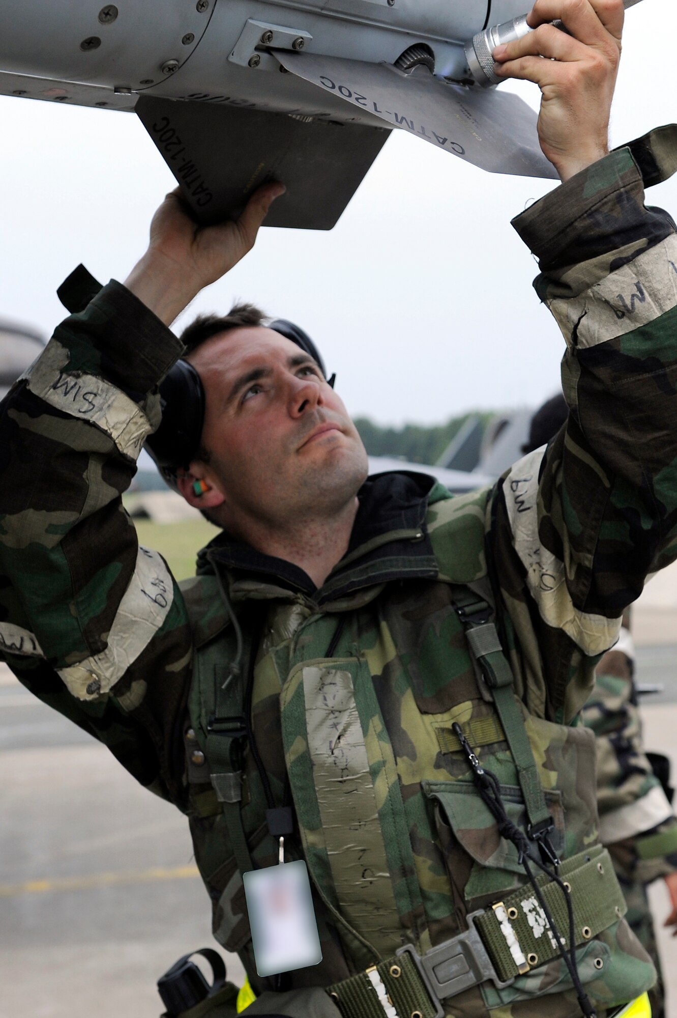 MISAWA AIR BASE, Japan -- Staff Sgt. Patrick Cannon, 14th Aircraft Maintenance Unit weapons load team chief, performs a pre-flight inspection on an F-16 Fighting Falcon during a training exercise June 22. During the training exercise, Airmen practice operating in a combat environment. (U.S. Air Force photo/Staff Sgt. Marie Brown/Released)
