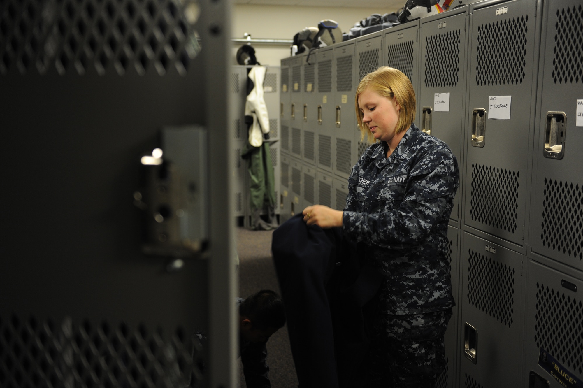 JOINT BASE ELMENDORF RICHARDSON, Alaska -- U.S. Navy Parachute Rigger Airman Jessica Tescher puts away a pilot's gear and prepares the locker for future flights during Exercise Northern Edge 11, in JBER, Alaska, June 16, 2011. Northern Edge, Alaska's largest military training exercise, is designed to prepare joint forces to respond to crises throughout the Asia-Pacific region. (Photo by Mass Communication Specialist 2nd Class Rufus Hucks)