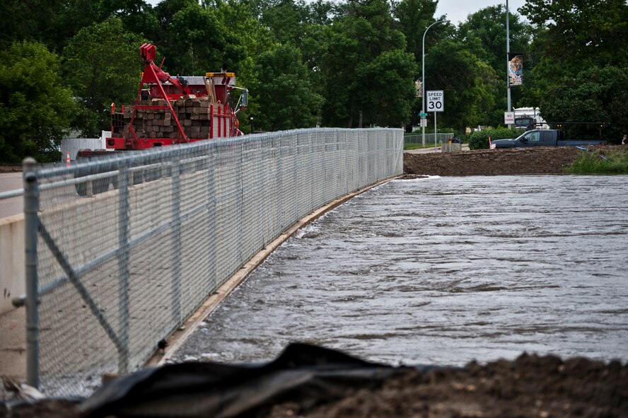 Minot Air Force Base, N.D.—Air Force Global Strike Command Airmen, Minot city officials, the National Guard, and the Corps of Engineers here are preparing for the worst flood in this city’s history. By Monday, June 29, 2011, Mouse River pressures and heights will reach unprecedented levels—seven to ten feet higher than the all time record with pressures reaching approximately 16,000 cubic feet per second. On June 22, 2011 the river, breached the levees and the warning sirens sounded requiring the immediate evacuation of over 11,000 Minot residents. (U.S. Air Force photo/Staff Sgt. John D. Comer)
