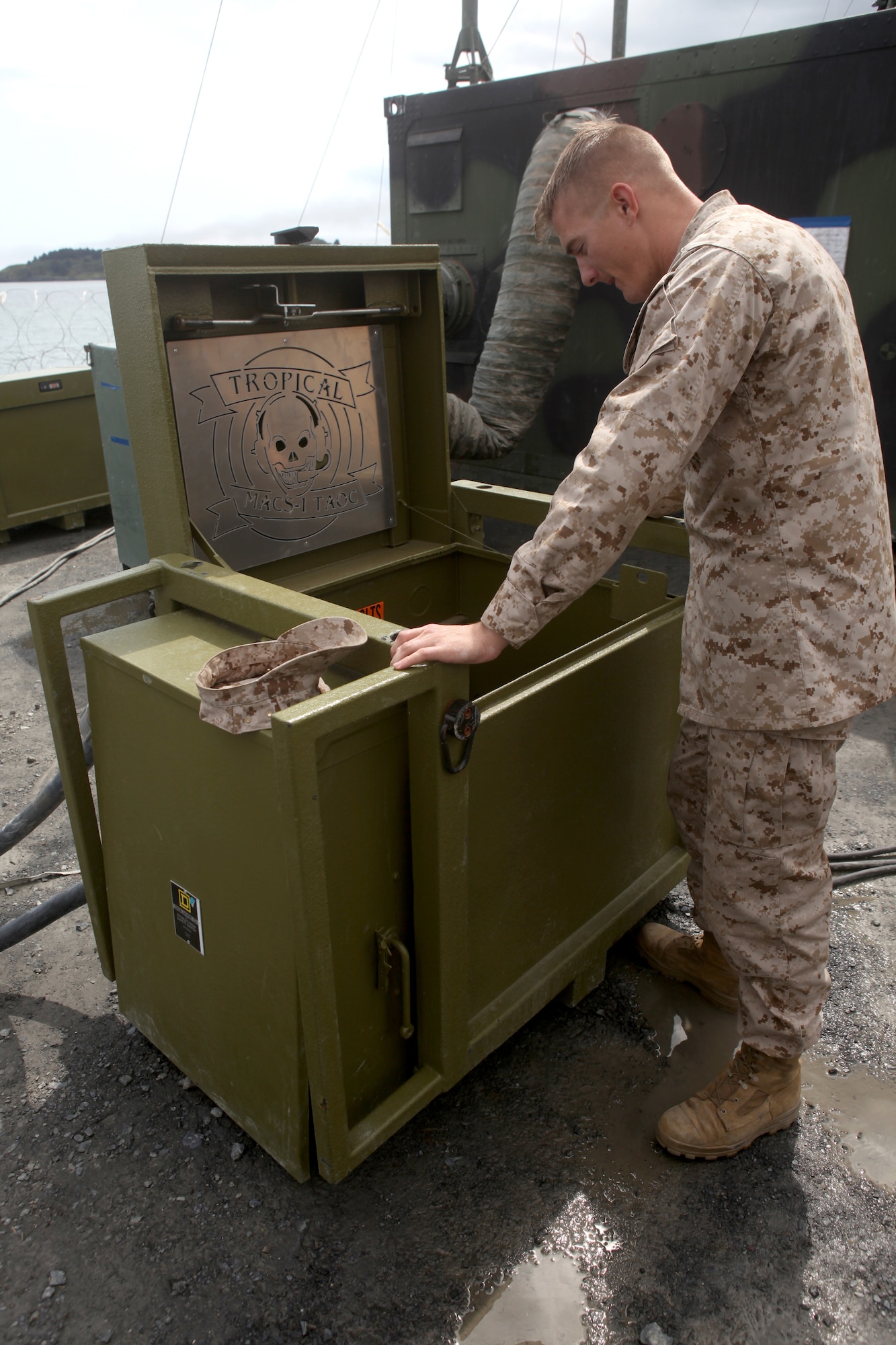 KODIAK, Alaska -- Marine Cpl. Ryan Landis, a generator mechanic assigned to Marine Air Control Squadron-1, 3d Marine Aircraft Wing, performs routine maintenance on a generator at Coast Guard Base Kodiak, Alaska, June 14, 2011, during Exercise Northern Edge 11. (Marine Corps photo/Cpl. Marionne T. Mangrum)
