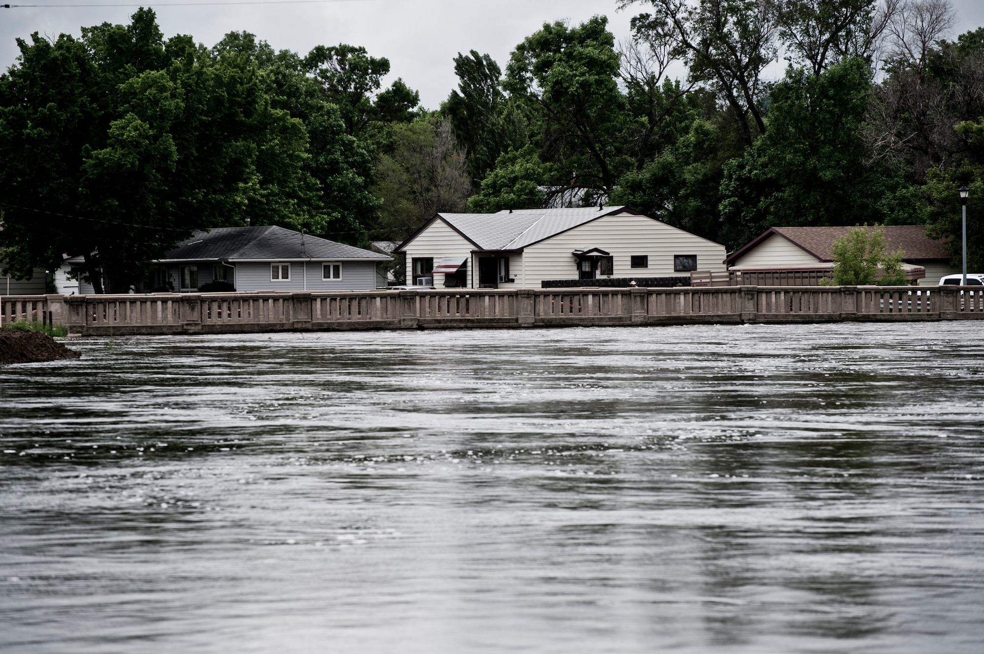 Minot Air Force Base, N.D.—Air Force Global Strike Command Airmen, Minot city officials, the National Guard, and the Corps of Engineers here are preparing for the worst flood in this city’s history. By Monday, June 29, 2011, Mouse River pressures and heights will reach unprecedented levels—seven to ten feet higher than the all time record with pressures reaching approximately 16,000 cubic feet per second. On June 22, 2011 the river, breached the levees and the warning sirens sounded requiring the immediate evacuation of over 11,000 Minot residents. (U.S. Air Force photo/Staff Sgt. John D. Comer)
