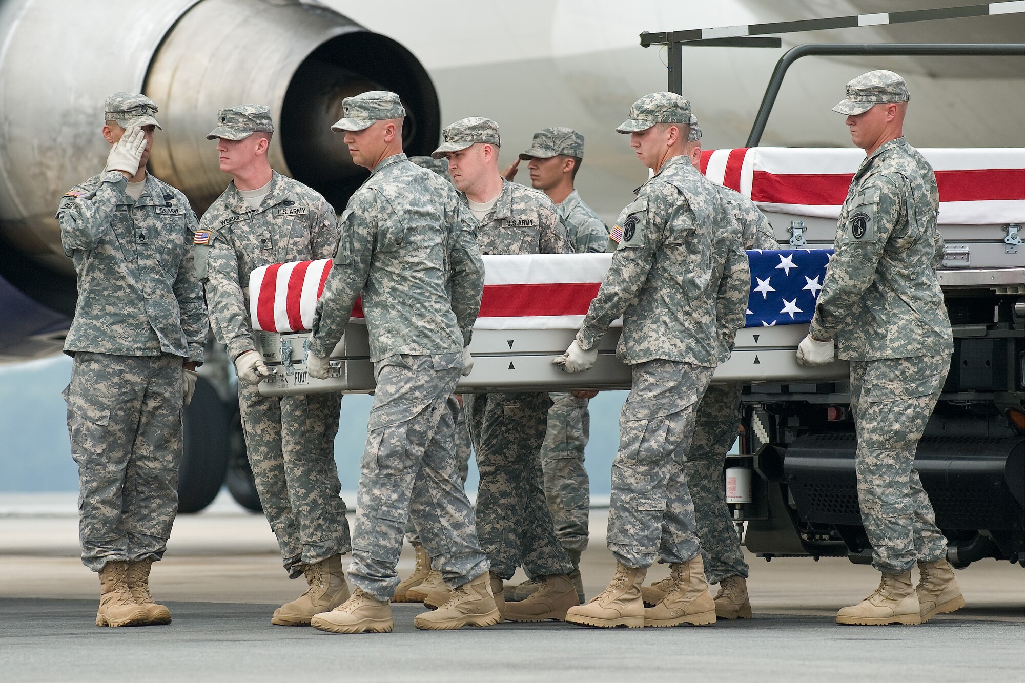 A U.S. Army carry team transfers the remains of Army Cpl. James W. Harvey II, of Toms River, N.J., at Dover Air Force Base, Del., June 22, 2011. Harvey was assigned to the 2nd Battalion, 2nd Infantry Regiment, 3rd Brigade Combat Team, 1st Infantry Division, Fort Knox, Ky. (U.S. Air Force photo/Roland Balik)
