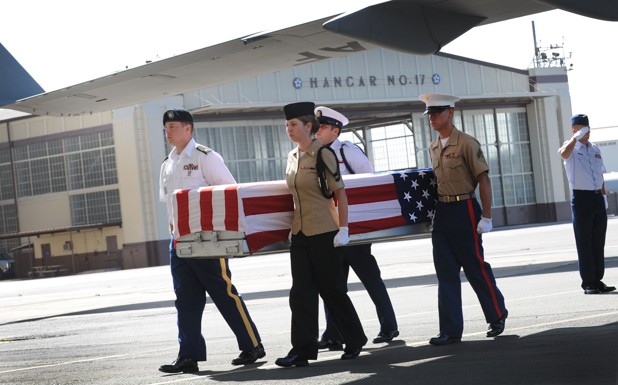 Military members transfer the remains of a U.S. service member June 17, 2011, during an arrival ceremony at Joint Base Pearl Harbor-Hickam, Hawaii.  The unidentified remains were recovered by members of the Joint Pacific Accounting Command. Following the ceremony, with full military honors, the remains were sent to JPAC's Central Identification Laboratory where forensic identification analysis will be conducted so they may be identified and returned to member’s family. (U.S. Air Force photo/Senior Airman Lauren Main) 