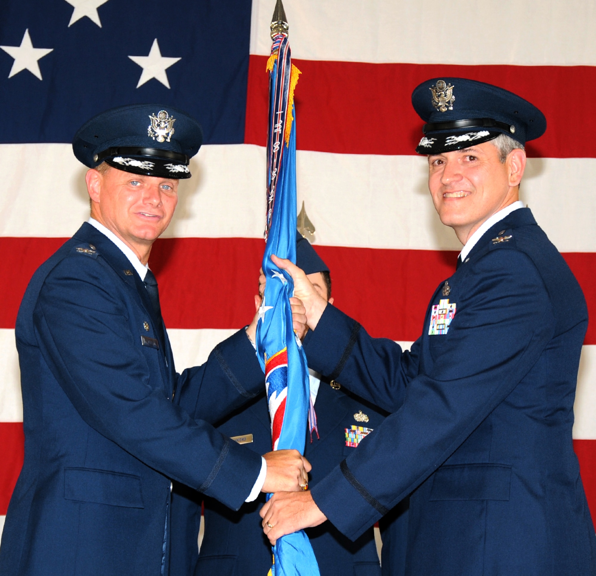 Col. Michael McDaniel, right, accepts the 71st Mission Support Group guidon from Col. Russ Mack, 71st Flying Training Wing commander, during a change of command ceremony held June 17 at Vance AFB, Okla. (U.S. Air Force photo/ Terry Wasson)