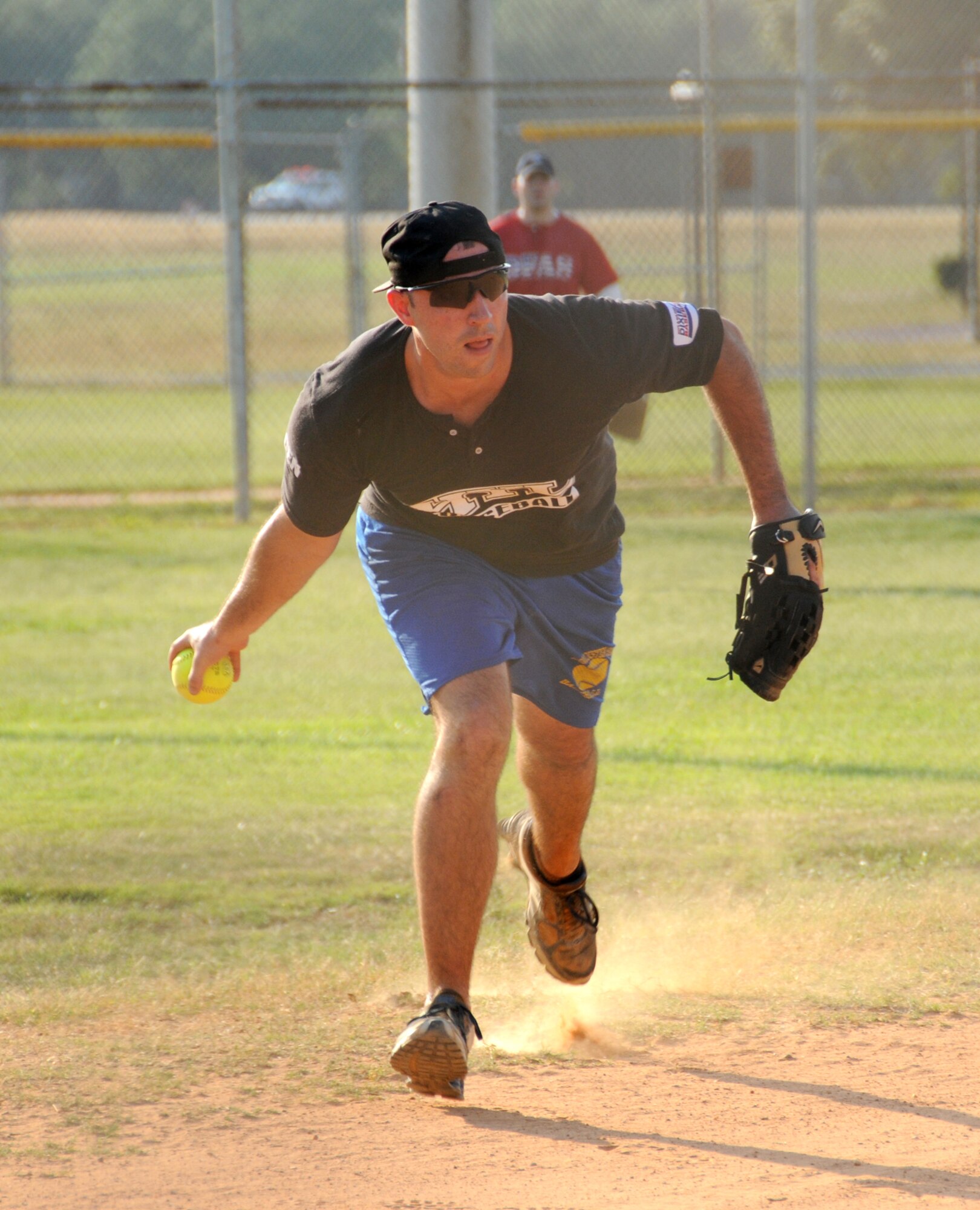 Bulls shortstop Joe Regan soft-tosses the ball to third base after snagging a ground ball. (U.S. Air Force photo by Kemberly Groue)