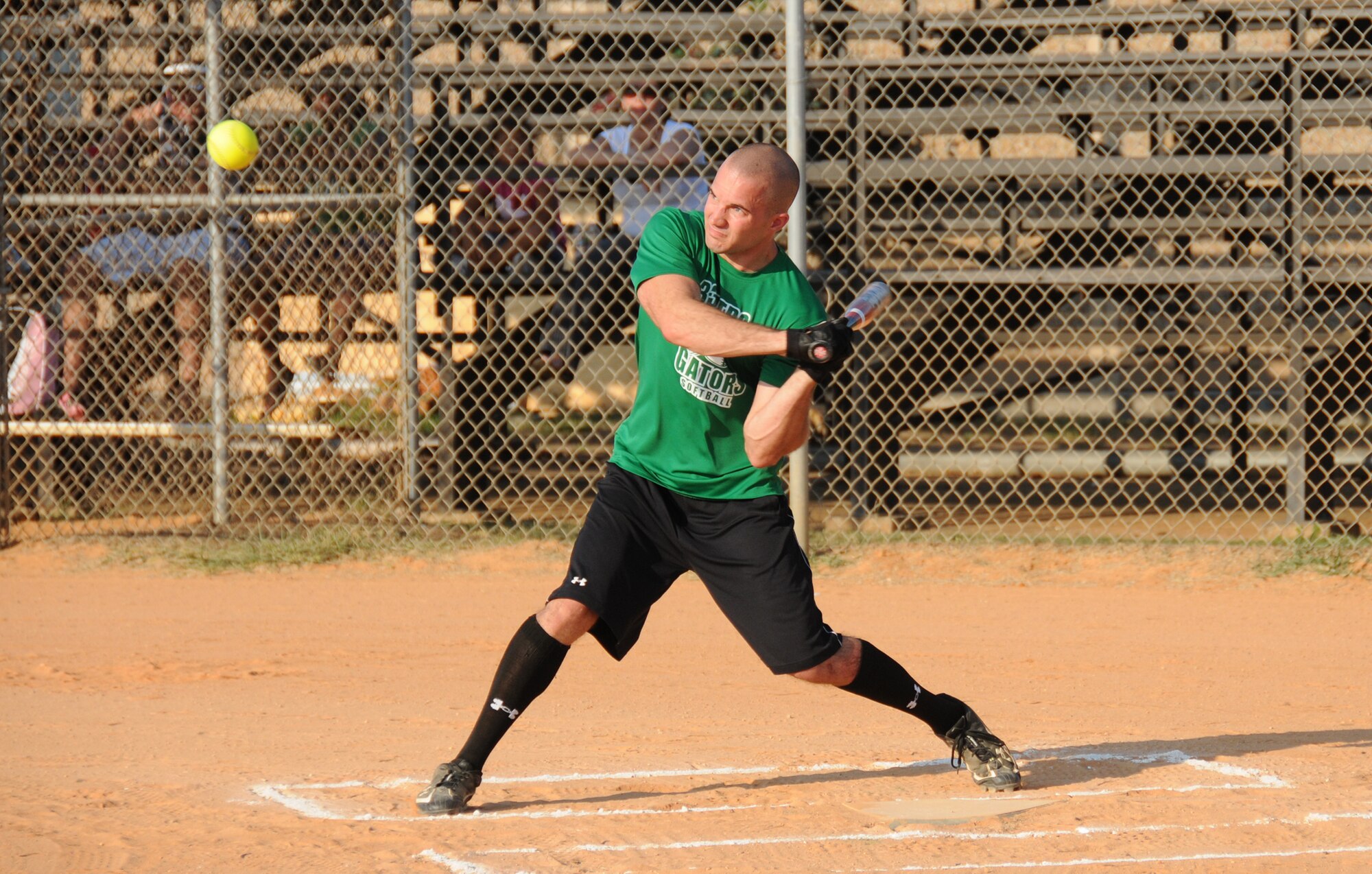 Nick Volz keeps a tight eye on the ball as he gets ready to take a swing for the Gators.  (U.S. Air Force photo by Kemberly Groue)