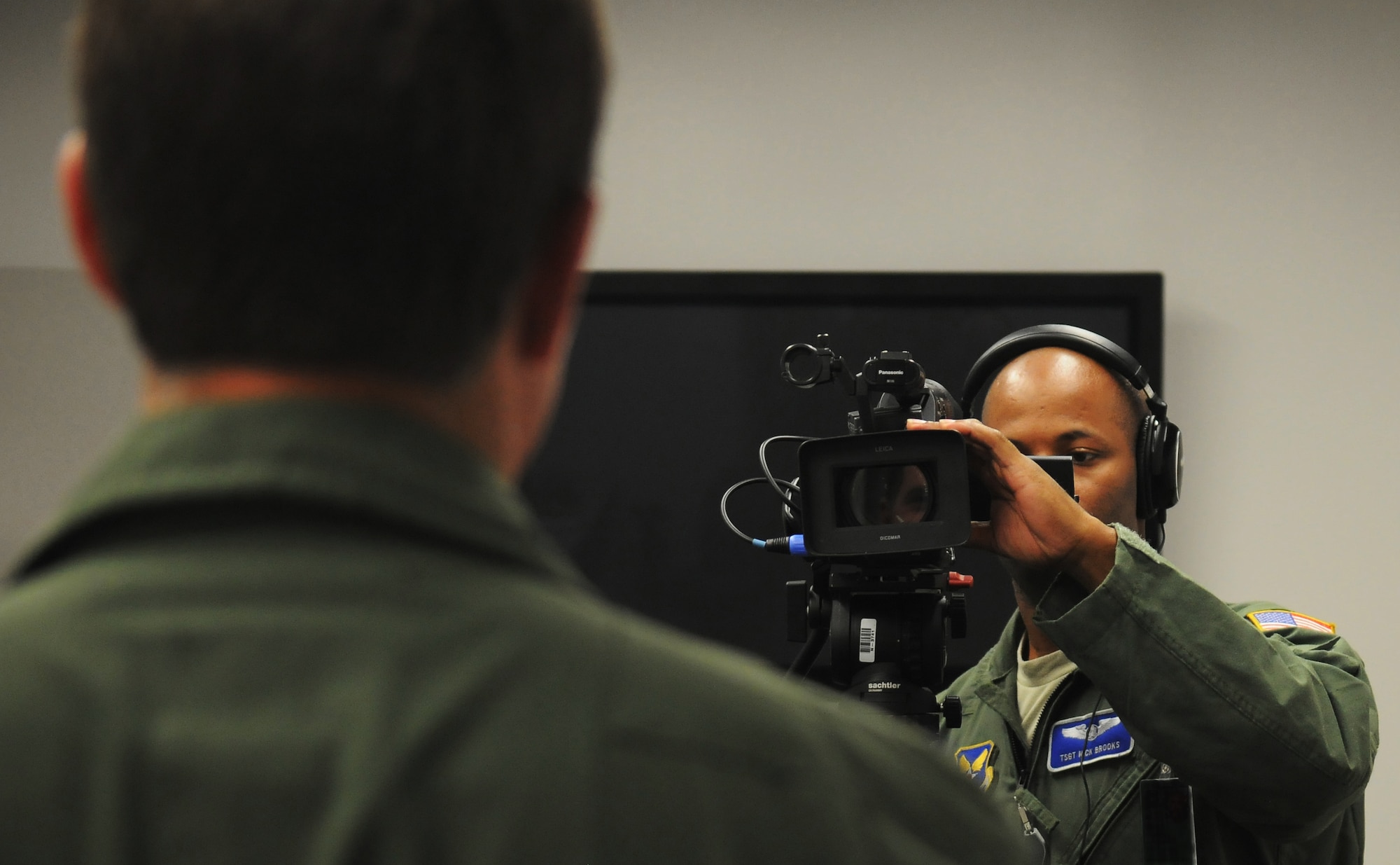 Tech. Sgt. Nick Brooks performs an interview June 20, 2011, Eielson Air Force Base, Alaska. NORTHERN EDGE 2011 Joint Information Bureau personnel work with a variety of on-base military organizations as well as local, national and international media to share military mission stories.  Sergeant Brooks is an aerial combat broadcaster assigned to the 1st Combat Camera Squadron, Charleston Air Force Base, South Carolina. (U.S. Air Force photo/Senior Airman Rachelle Coleman)