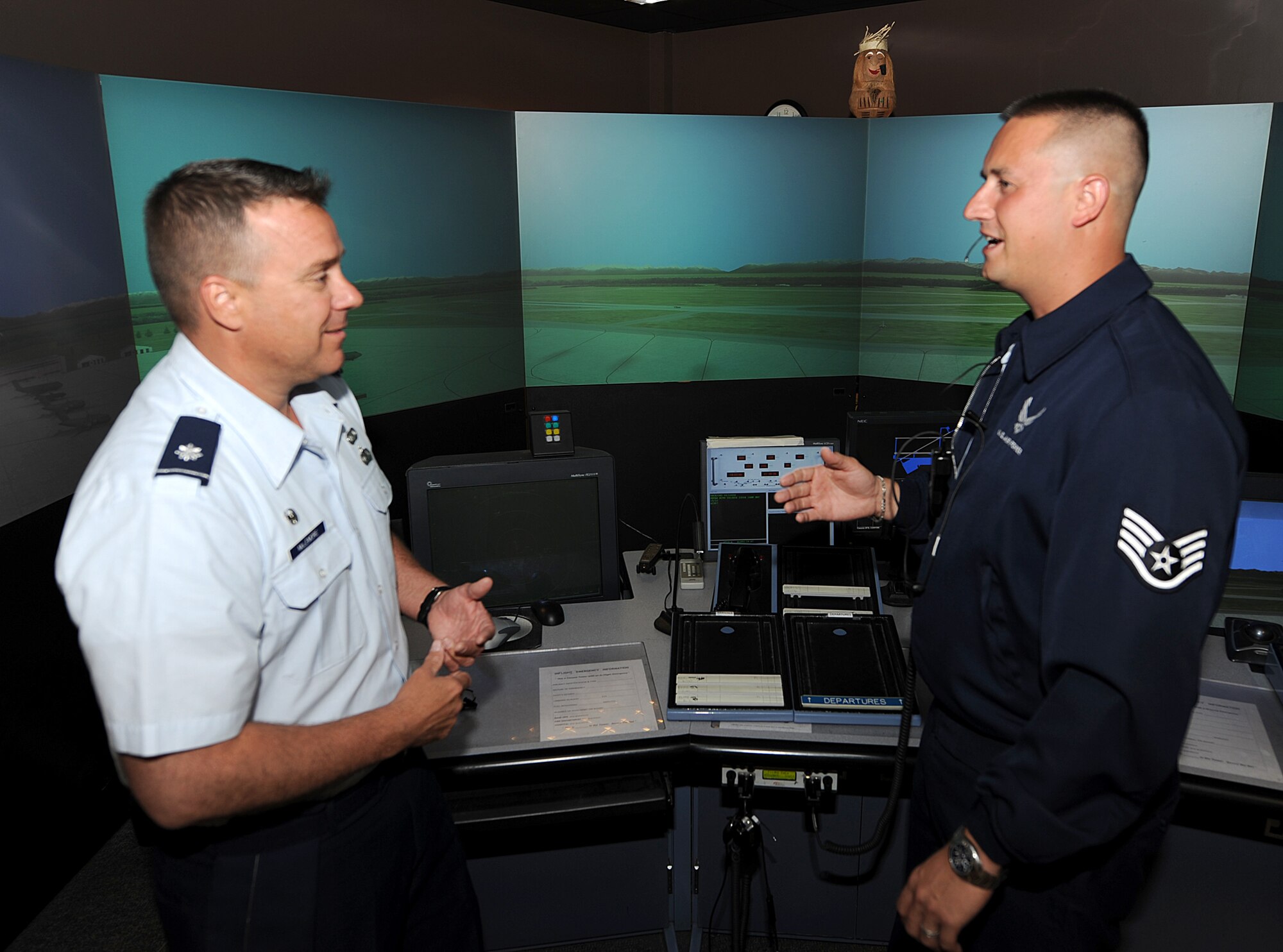 Lt. Col. Jeffrey McLemore, left, who assumed command of the 334th Training Squadron from Lt. Col. Michael Callender Friday, gets a tour of the air traffic control tower simulator Monday from Staff Sgt. Kevin McDonald, an instructor. The colonel previously served as deputy director of air traffic control and airfield management operations for the Air Force Flight Standards Agency in Oklahoma City. Colonel Callender becomes the deputy commander of the 422nd Air Base Group, Royal Air Force Creighton, England.  (U.S. Air Force photo by Kemberly Groue)