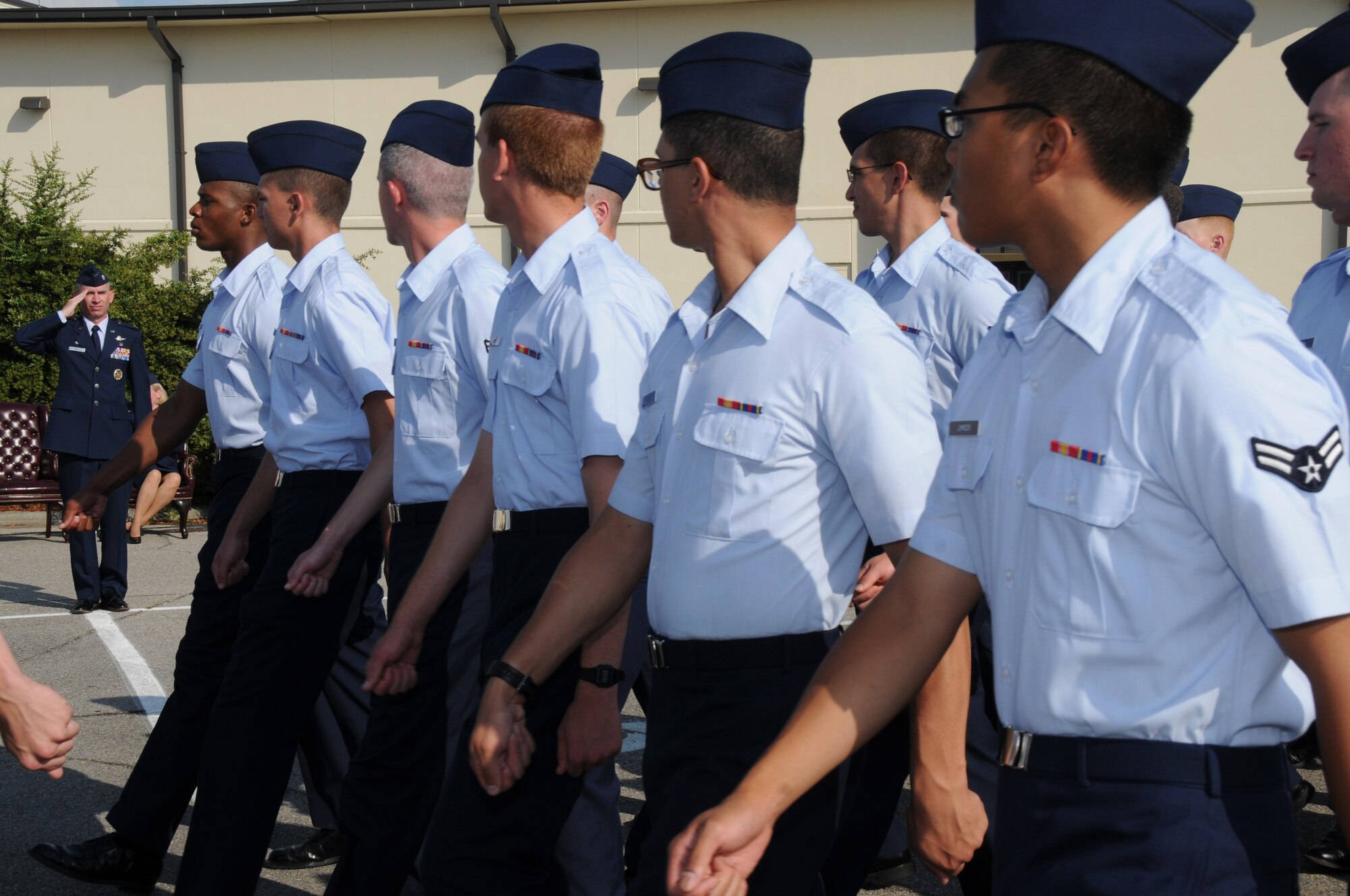 Lt. Col. Trevor Wall, 332nd Training Squadron commander, salutes the students of the
332nd TRS during the pass and review march at the 332nd TRS stand down ceremony, June 17. The ceremony was held in the parking lot outside Dolan Hall. Col Wall takes command of the 338th TRS June 29.  (U.S. Air Force photo by Kemberly Groue)