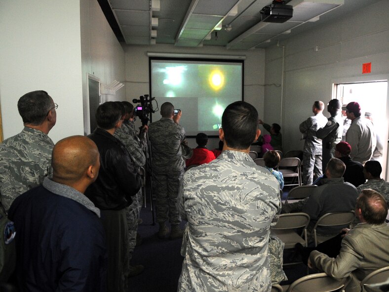 VANDENBERG AIR FORCE BASE, Calif. -- Distinguished guests attending the operational launch test of a Minuteman III intercontinental ballistic missile here witness the success of the missile’s flight via a live video feed, which tracked its course June 22. Following the launch early morning, guests turned to the screens indoors in order to view the continuation of the missile as it made its way approximately 4,200 miles west of the Pacific Ocean, to its pre-determined target. (U.S. Air Force photo/Airman 1st Class Jose L. Hernandez) 
