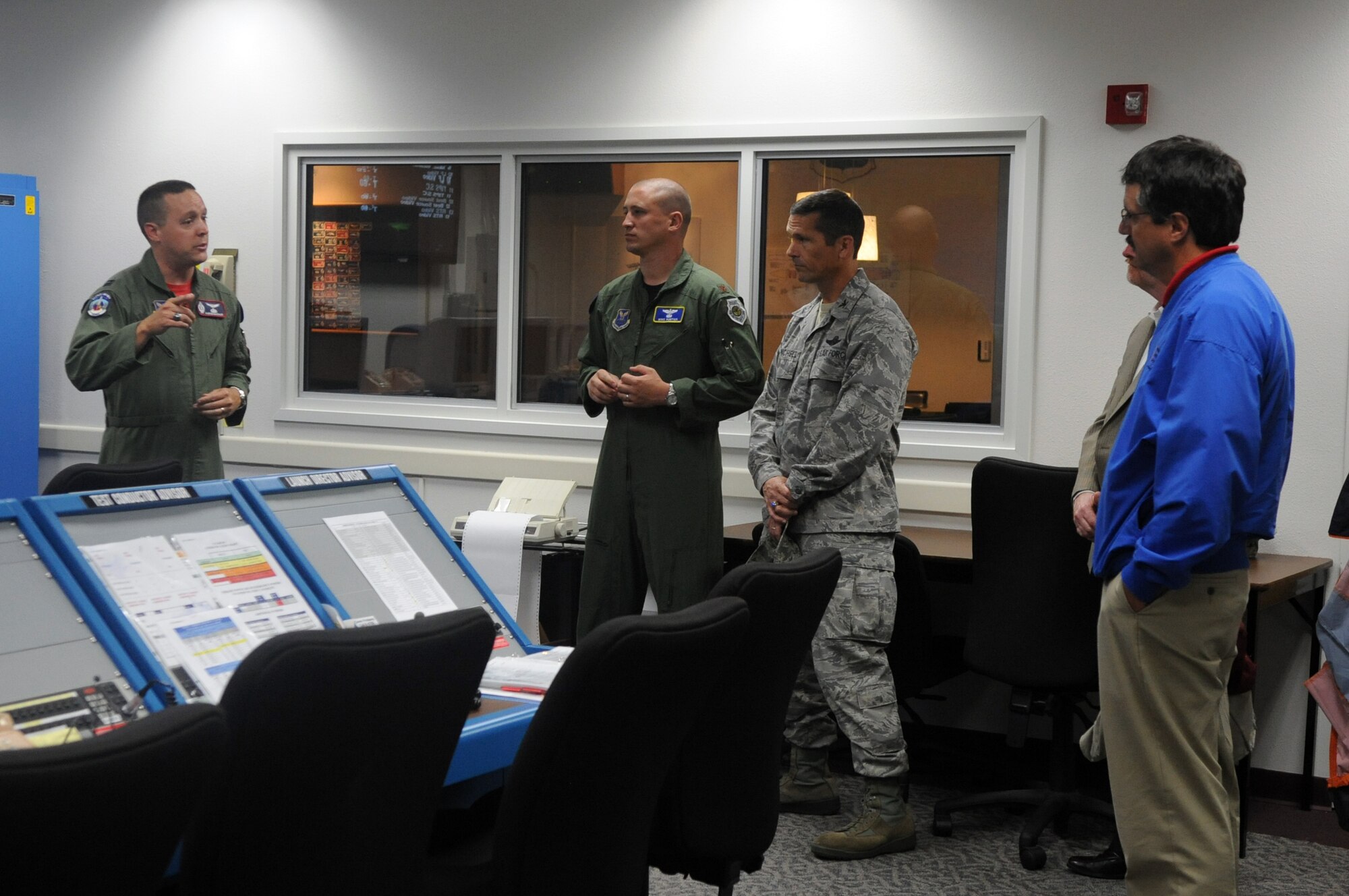 VANDENBERG AIR FORCE BASE, Calif. -- Captain Aaron Basham, 576th Flight Test Squadron test manager, explains the importance of the launch support center to attendees of the operational launch test of a Minuteman III intercontinental ballistic missile here June 22. The launch support includes a test conductor advisor, launch director advisor, and test conductor among others positions essential for executing a test launch. (U.S. Air Force photo/Airman 1st Class Jose L. Hernandez) 

