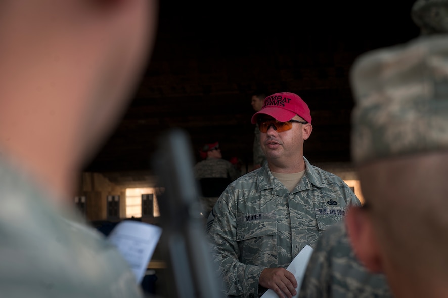 U.S. Air Force Master Sgt. Brian Rodney, 820th Combat Operations Squadron combat arms instructor,  provides Airmen with rules and guidelines for the Excellence In Competition Shooting event at Moody Air Force Base, Ga., June 21, 2011. The idea for the competition came from Col. Randall Richert, 820th Base Defense Group commander, and took an estimated four months to plan. (U.S. Air Force photo by Airman 1st Class Joshua Green/Released)
