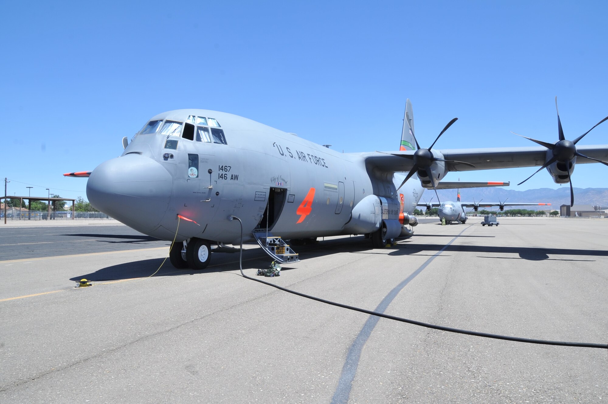 KIRTLAND AIR FORCE BASE, N.M. -- In support of the National Interagency Fire Center, the 115th Air Expeditionary Airlift Squadron, California Air National Guard, Channel Islands Air National Guard Station, Calif., brought two C-130J aircraft equipped with Modular Airborne Fire Fighting Systems to help control wildfires in the Southwestern U.S. (Air Force photo by Elizabeth Martinez.) 