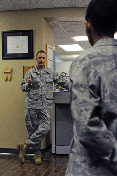 Chief Master Sgt. Charles Cole, Chief of the Medical Enlisted Force, speaks with members of the 2nd Dental Squadron in the dental clinic on Barksdale Air Force Base, La., June 21. Chief Cole toured Barksdale's medical and dental facilities and visited with Airmen from the 2nd Medical Group. (U.S. Air Force photo/ Airman 1st Class Micaiah Anthony)(RELEASED)