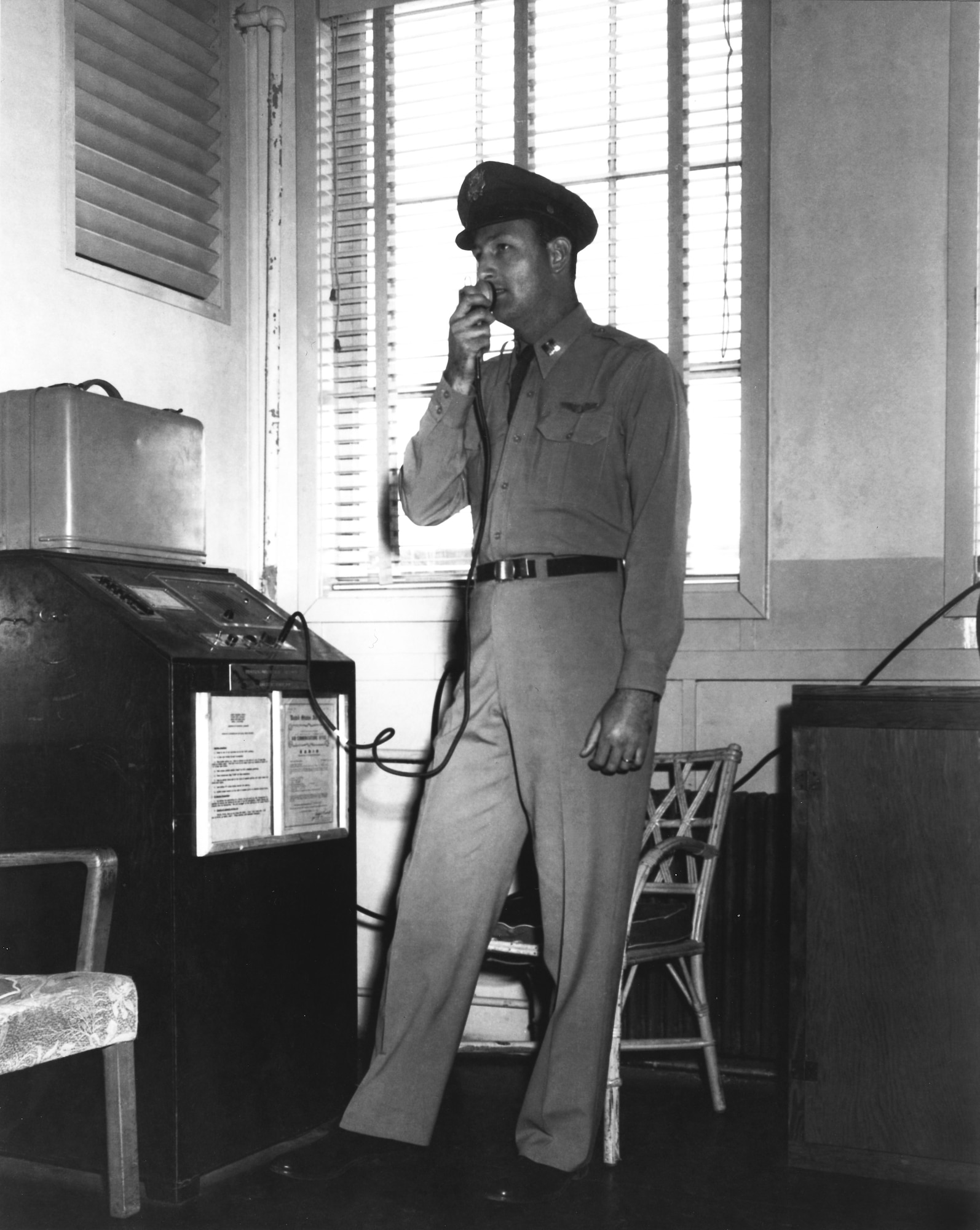 Capt. Fitz Fulton, just beginning his career, is shown here using the radio at Flight Test Operations in April 1951. (Air Force photo)