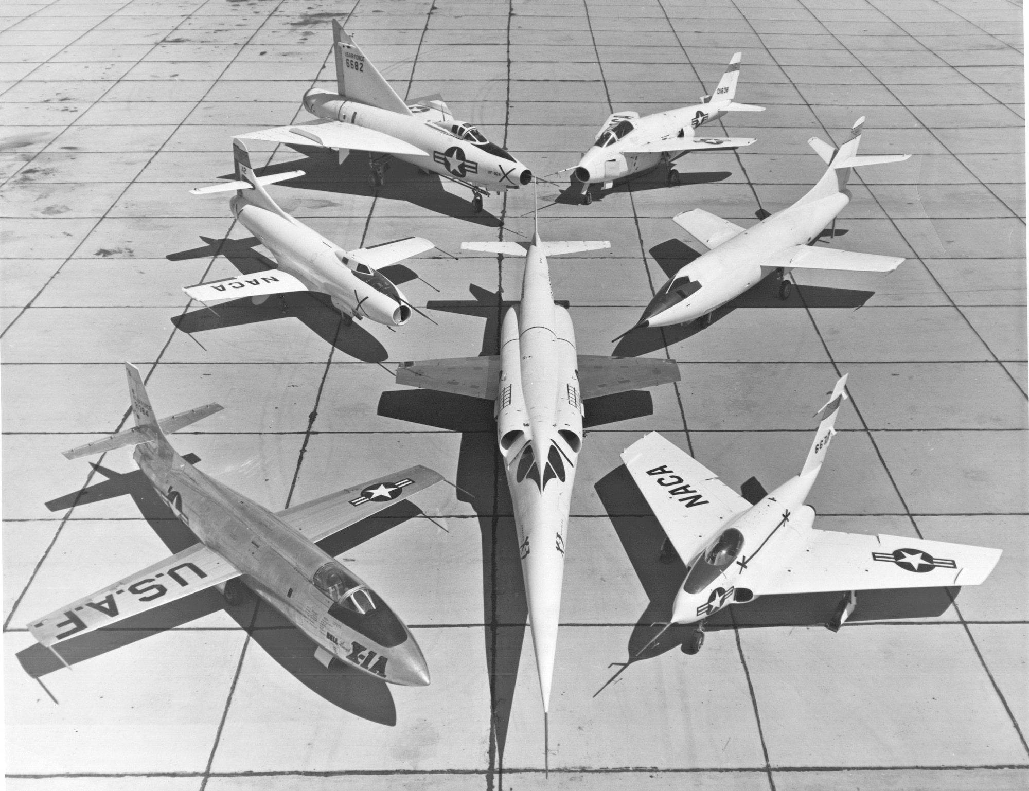 X-planes at Edwards: In the center is the Douglas X-3 Stiletto research aircraft. Clockwise from the top: The Bell X-5 variable-sweep wing jet research aircraft; the Navy’s Douglas D-558-II Skyrocket swept-wing aircraft; the Northrop X-4, the Douglas D-558-I Skystreak and the Convair experimental XF-92A Dart. These aircraft were being tested a little before the birth of the Air Force Flight Test Center, June 25, 1951. (Air Force photo)