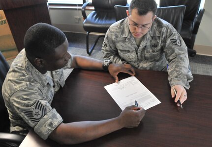 Tech. Sgt. Clifton Ancrum, 628th Comptroller Squadron financial management flight noncommissioned officer in charge, and Staff Sgt. Dan Garrison, Rodeo team member from 628 CPTS, practice budgeting scenarios June 21 on Joint Base Charleston - Air Base for the upcoming Air Mobility Rodeo. The Rodeo, an air mobility readiness competition, is set to take place July 24 to 29 on Joint Base Lewis-McChord, Wash, and will incorporate comptroller squadrons for the first time. (U.S. Air Force photo /Airman 1st Class Jared Trimarchi)
