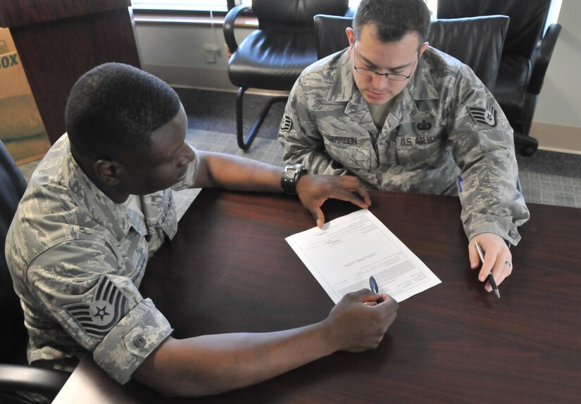 Tech. Sgt. Clifton Ancrum, 628th Comptroller Squadron financial management flight noncommissioned officer in charge, and Staff Sgt. Dan Garrison, Rodeo team member from 628 CPTS, practice budgeting scenarios June 21 on Joint Base Charleston - Air Base for the upcoming Air Mobility Rodeo. The Rodeo, an air mobility readiness competition, is set to take place July 24 to 29 on Joint Base Lewis-McChord, Wash, and will incorporate comptroller squadrons for the first time. (U.S. Air Force photo /Airman 1st Class Jared Trimarchi)