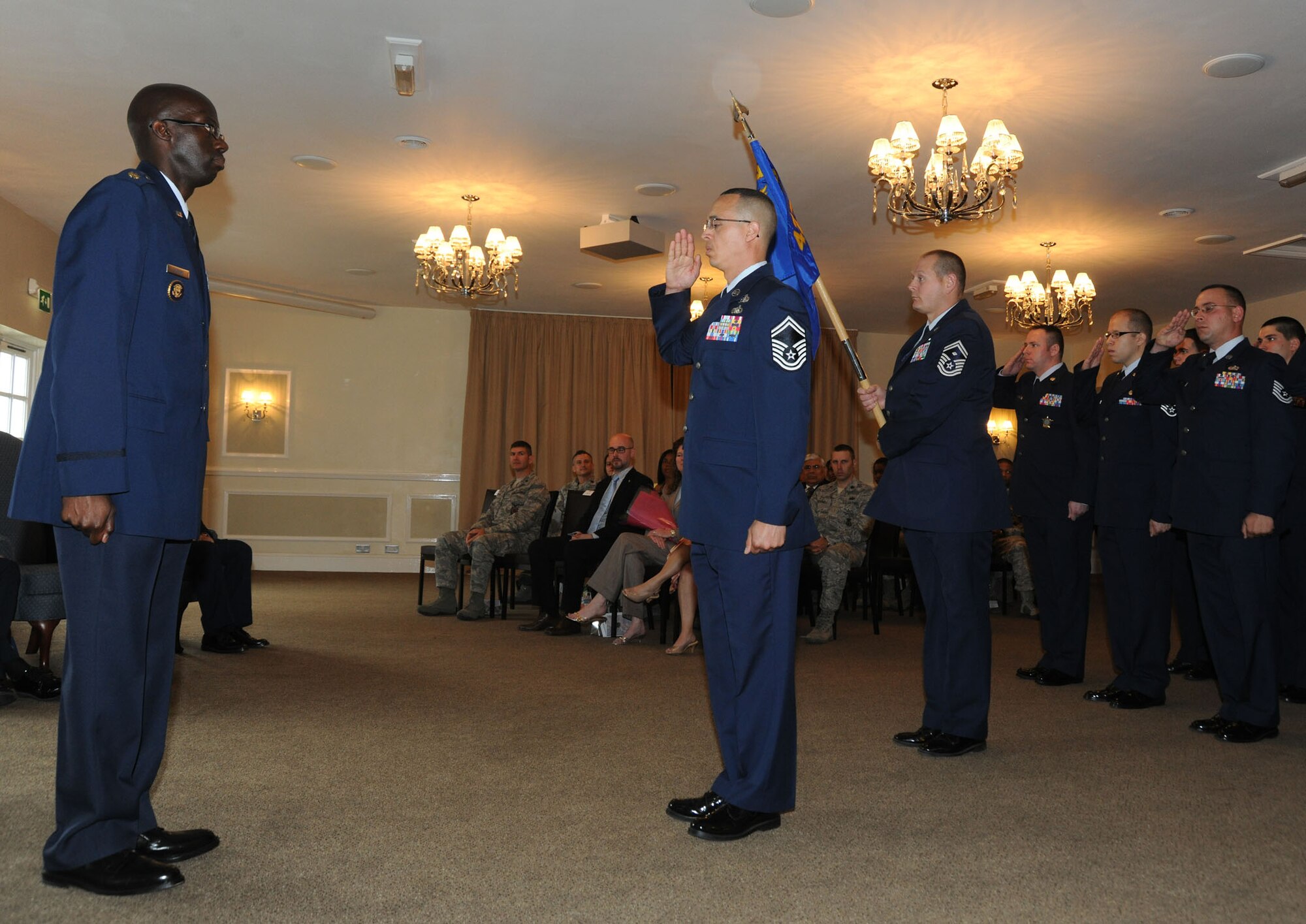 Maj. Carlos Alford receives the first salute rendered to him as the new 423rd Communications Squadron commander during a change of command ceremony June 22. 