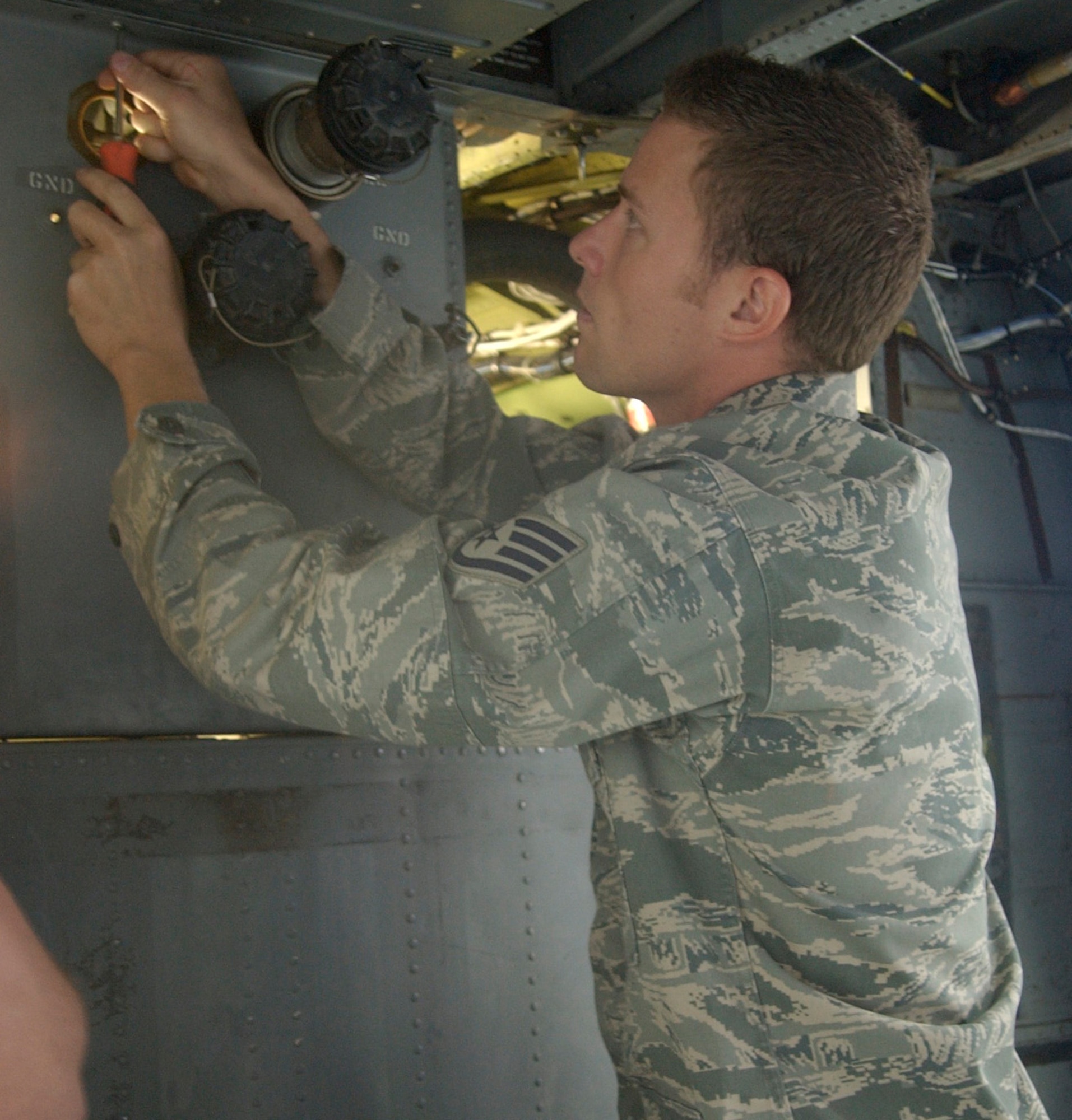 Staff Sgt. Caleb Hiner, 943rd Maintenance Squadron crew chief, works on removing a fuels package in order to repair a broken break away valve on the HH-60 Pave Hawk helicopter in side of the 943rd MXS hangar at Davis Monthan Air Force Base, Ariz. The 943rd Rescue Group consistently upholds one of the highest mission-capability rates in Air Force Reserve Command. (U.S. Air Force Photo/ Tech. Sgt. Luke Johnson)