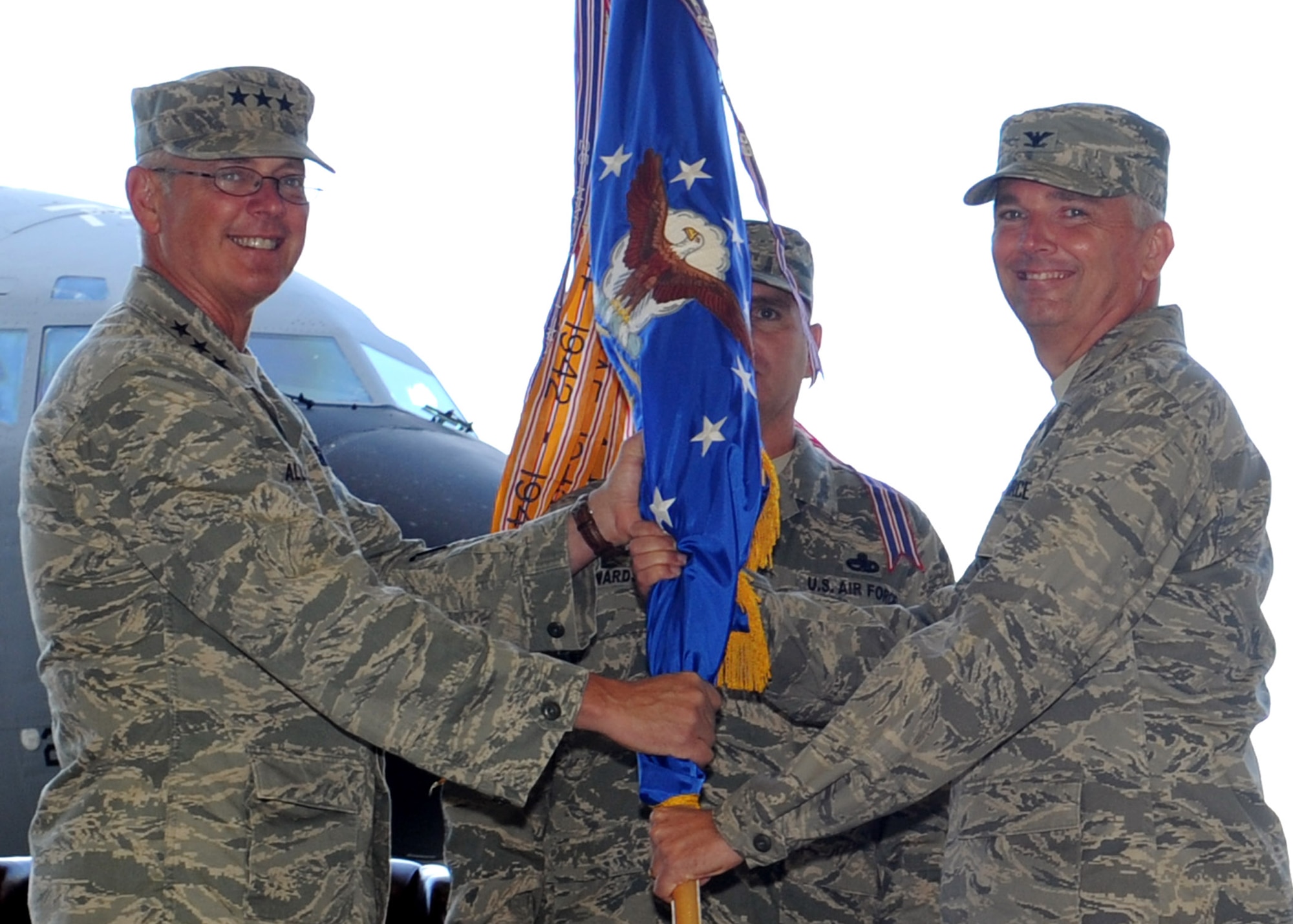 [Left to right] Lt. Gen. Robert Allardice, 18th Air Force commander, passes the guidon to Col. Ricky Rupp, giving him command of the 22nd Air Refueling Wing at the wing change of command ceremony June 21, 2011, McConnell Air Force Base, Kan. The passing of the guidon symbolizes Colonel Rupp’s assumption of command from the outgoing 22nd ARW commander Col. Jamie Crowhurst.  (U.S. Air Force photo/Airman 1st Class Katrina Brisbin)