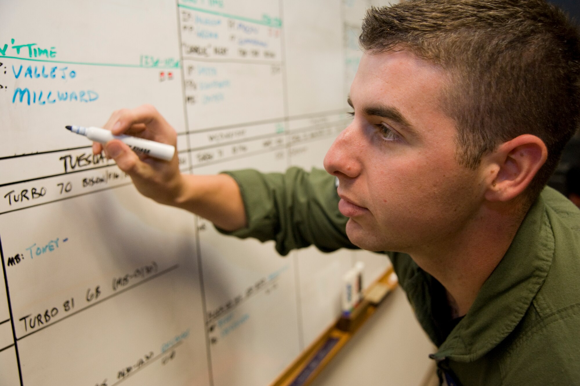 Airman 1st Class Adam Joachim, 344th Air Refueling Squadron boom operator, reviews the scheduling board June 16, 2011, McConnell Air Force Base, Kan.  The Inverness, Fla., native performs in-flight refueling with the largest air refueling wing in the world.  (U.S. Air Force photo/Airman 1st Class Armando A. Schwier-Morales)
