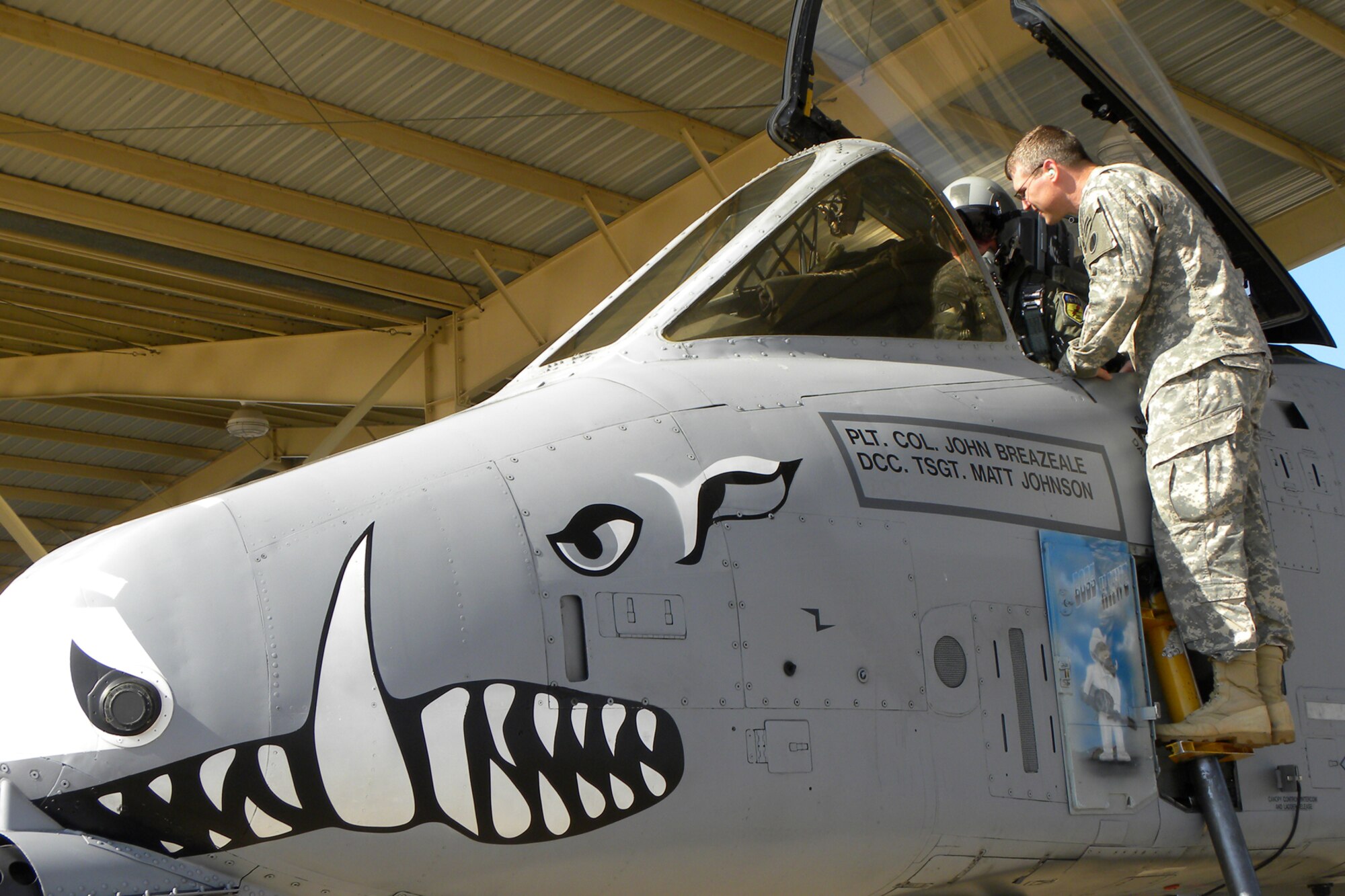Lt. Col. James Macaulay, deputy commander, 917th Fighter Group, explains the capabilities of the A-10 Thunderbolt II, to Lt. Col. Sherb Sentell, battalion commander, 2203rd Mobilization Support Battalion, during his visit to Barksdale Air Force Base, La., June 16, 2011. A small group from the Army visited Barksdale to get a close up look at the type of jet that provides “dedicated air support” to their unit members in the field in Iraq and Afghanistan. Colonel Sentell’s unit is based in Bossier City, La. (U.S. Air Force photo/Betty Stephens)