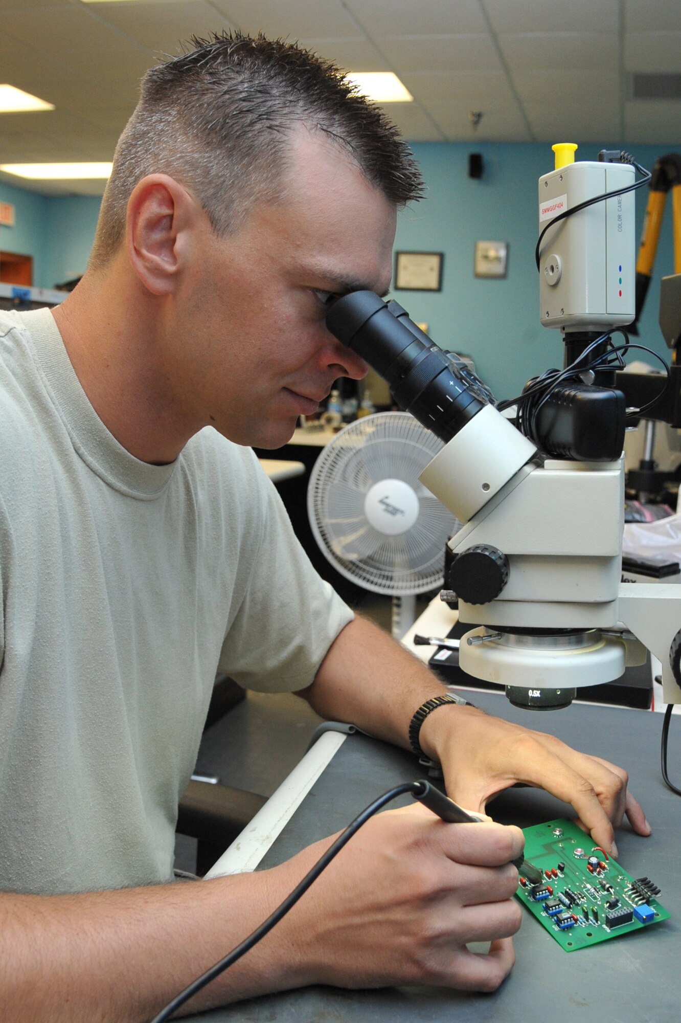 SEYMOUR JOHNSON AIR FORCE BASE, N.C.- Staff Sgt. Erik Chenault performs a visual inspection on a controller circuit cord assembly during a troubleshoot in the Air Force Repair Enhancement Program (AFREP) office here, June 21, 2011. During a troubleshoot, all components on a circuit board are inspected. AFREP Airmen repair broken items to save the Air Force money.  Sergeant Chenault is a 4th Maintenance Operations Squadron circuit cord repair technician and native of Lexington, Ky. (U.S. Air Force photo by Senior Airman Whitney Lambert/ Released) 