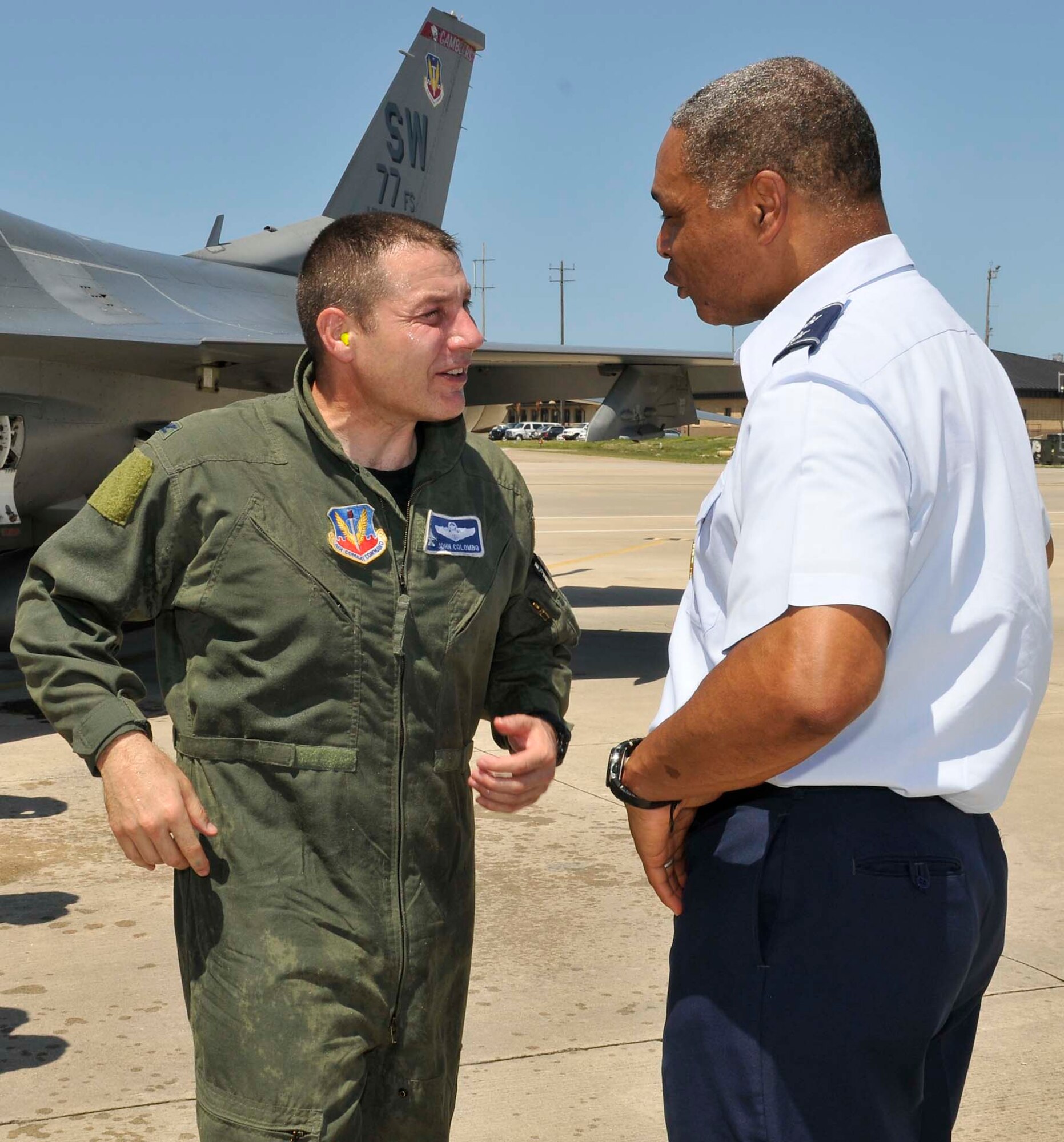 Col. John Colombo, Air Forces Northern, speaks with Maj. Gen. Garry C. Dean, AFNORTH commander, after his fini-flight at Tyndall Air Force Base, Fla., June 20. During his 24-year career as a fighter pilot, Colonel Colombo flew 3,570 hours. (U.S. Air Force photo by Lisa Norman)