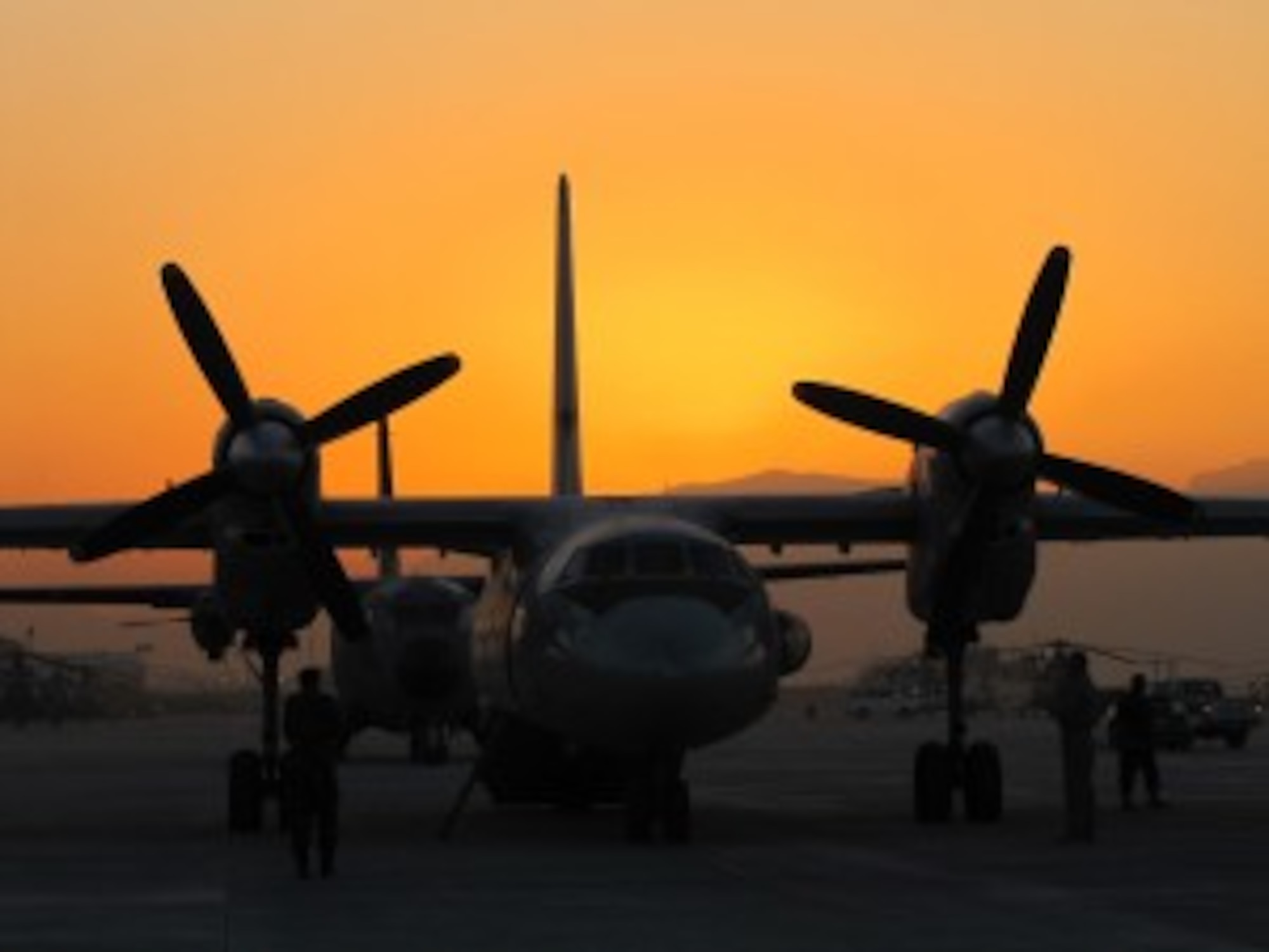 KABUL, Afghanistan - Dawn breaks over an Afghan Air Force AN-32 aircraft prior to the Veteran's Day mission flown by AAF and NATO Air Training Command - Afghanistan aircrew on Nov. 11. (U.S. Air Force phot by Capt. Rob Leese)
