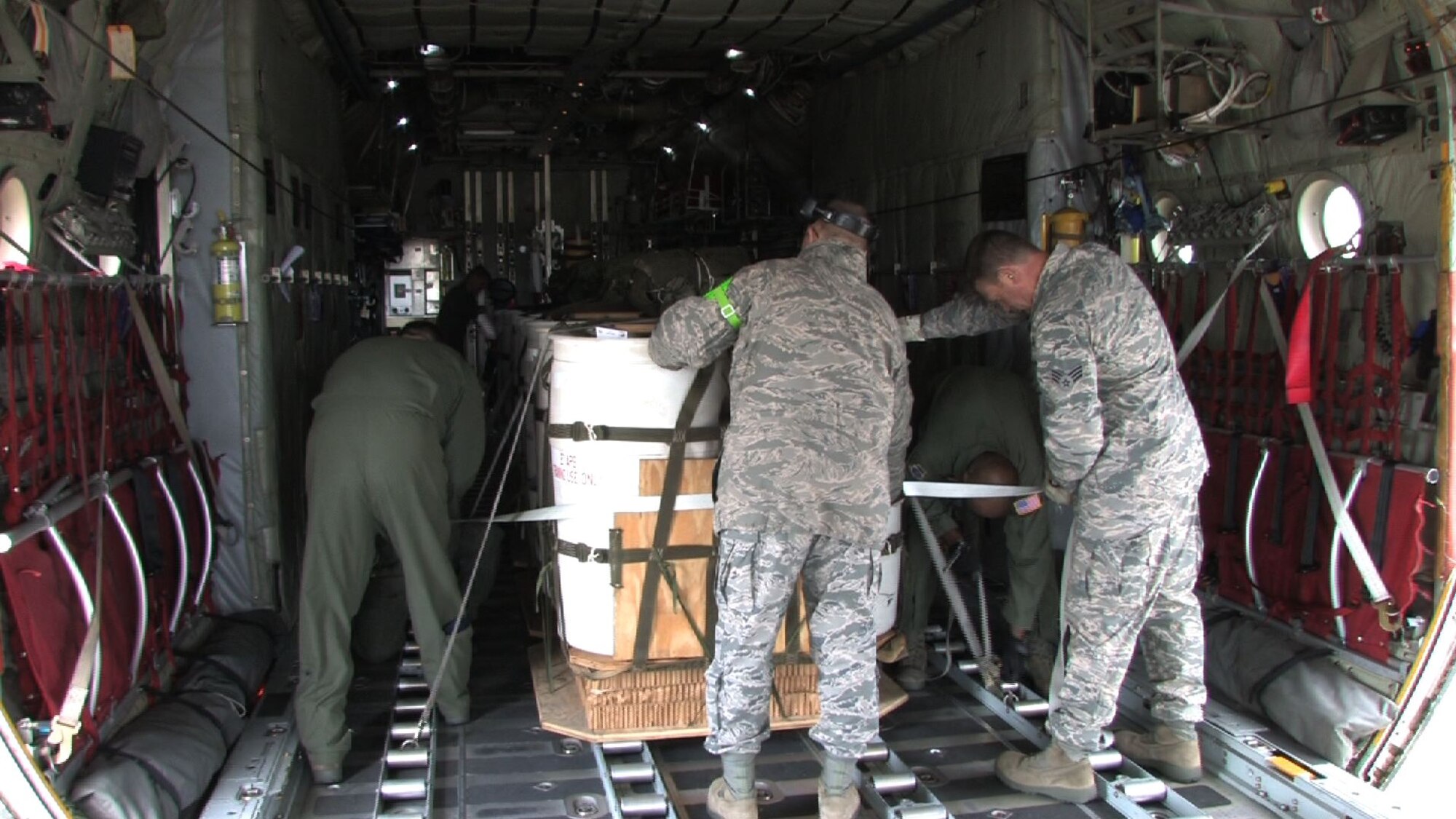 The 934th Airlift Wing conducts Inproved Container Delivery System training at the Arno Drop Zone at Camp Ripley, Minn. (Air Force Photo/Wendy Cormier) 