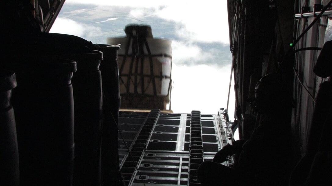 The 934th Airlift Wing conducts Inproved Container Delivery System training at the Arno Drop Zone at Camp Ripley, Minn. (Air Force Photo/Wendy Cormier) 