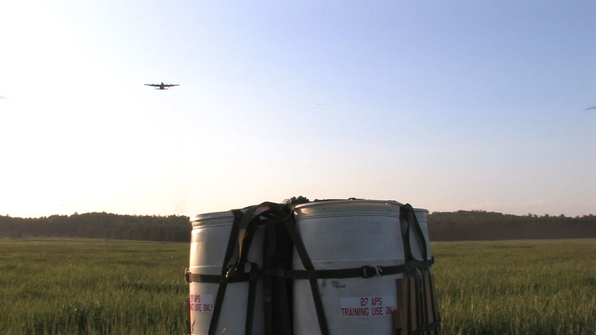 The 934th Airlift Wing conducts Inproved Container Delivery System training at the Arno Drop Zone at Camp Ripley, Minn. (Air Force Photo/Wendy Cormier) 
