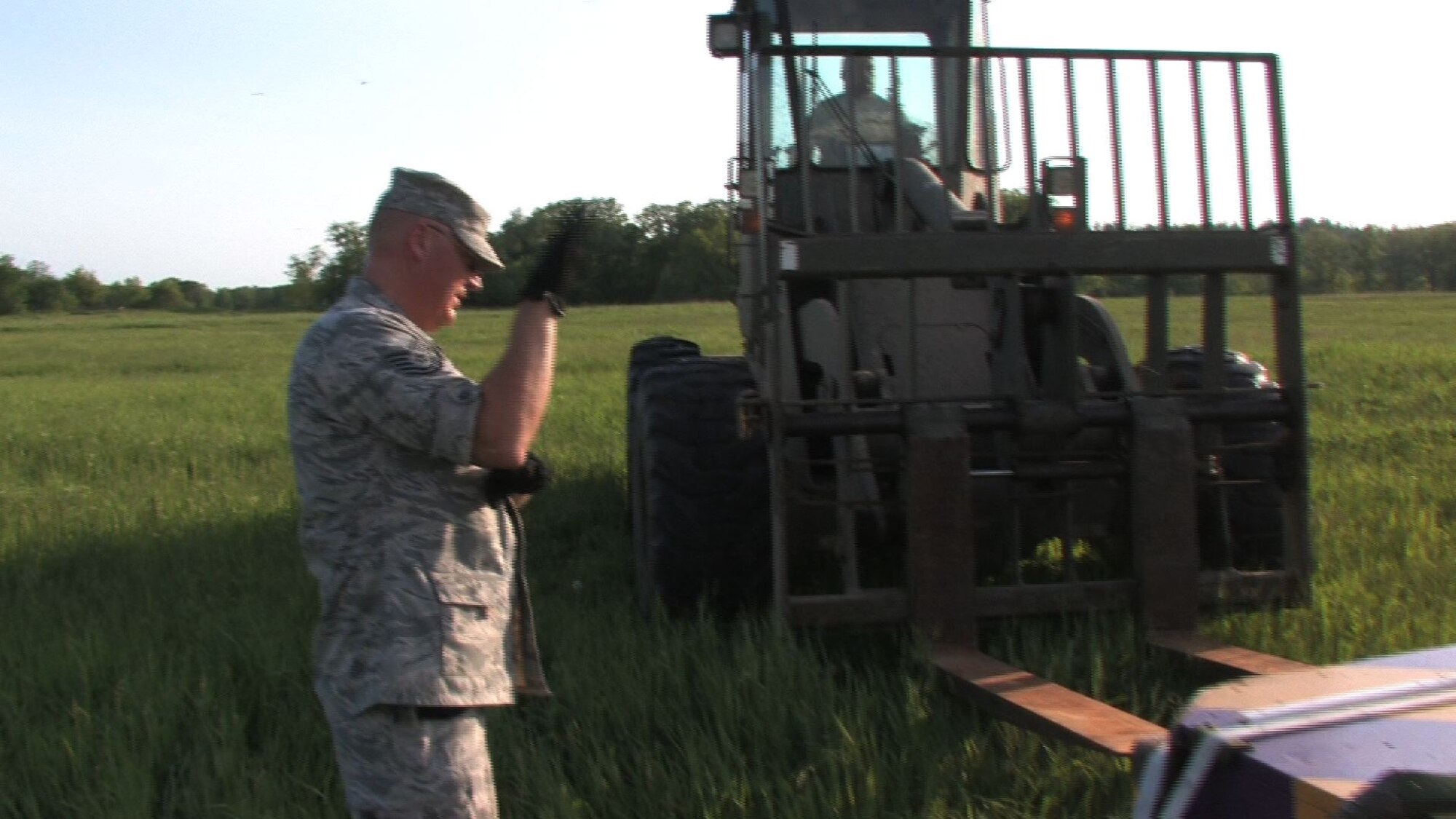 The 934th Airlift Wing conducts Inproved Container Delivery System training at the Arno Drop Zone at Camp Ripley, Minn. (Air Force Photo/Wendy Cormier) 