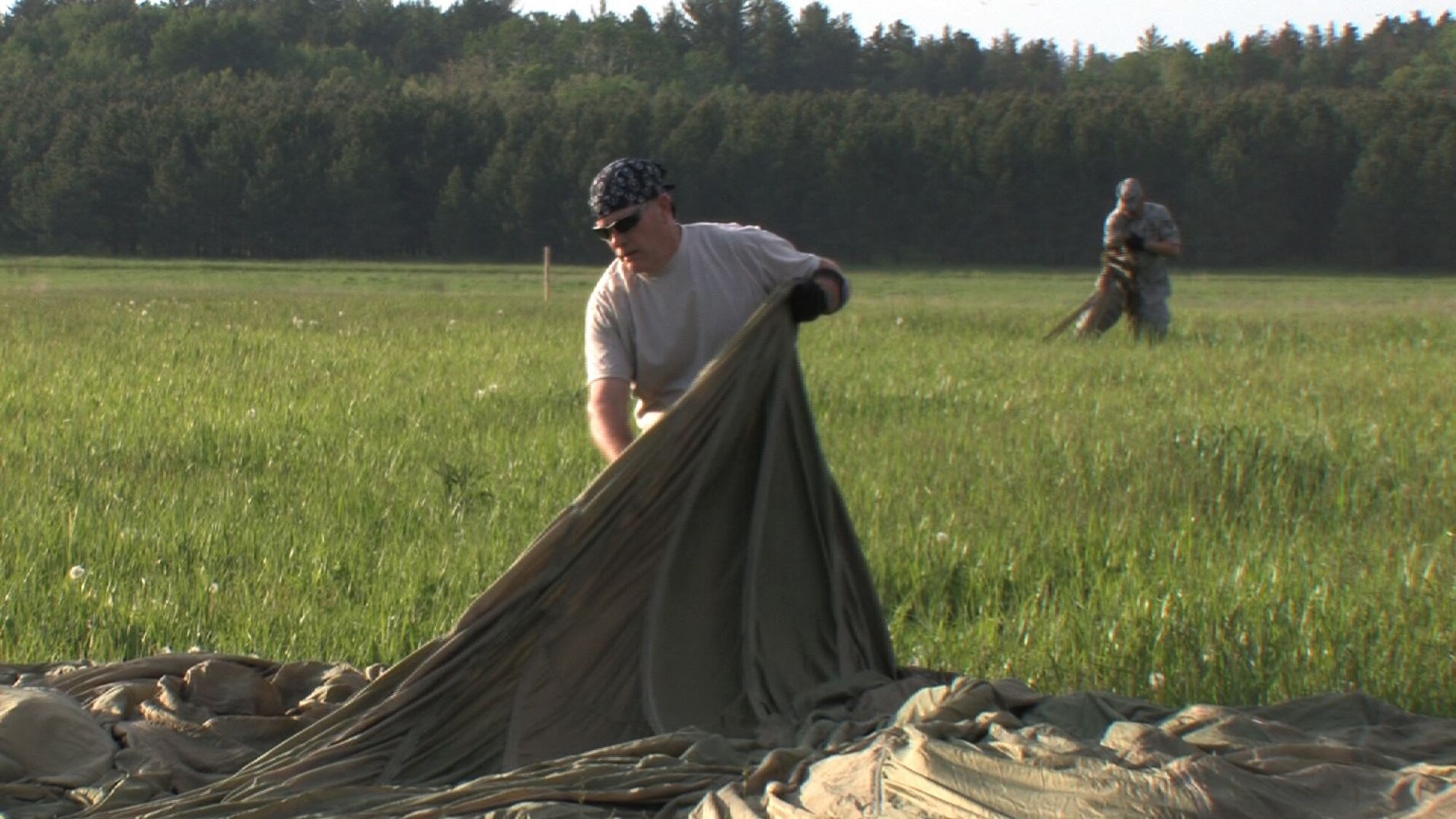 The 934th Airlift Wing conducts Inproved Container Delivery System training at the Arno Drop Zone at Camp Ripley, Minn. (Air Force Photo/Wendy Cormier) 