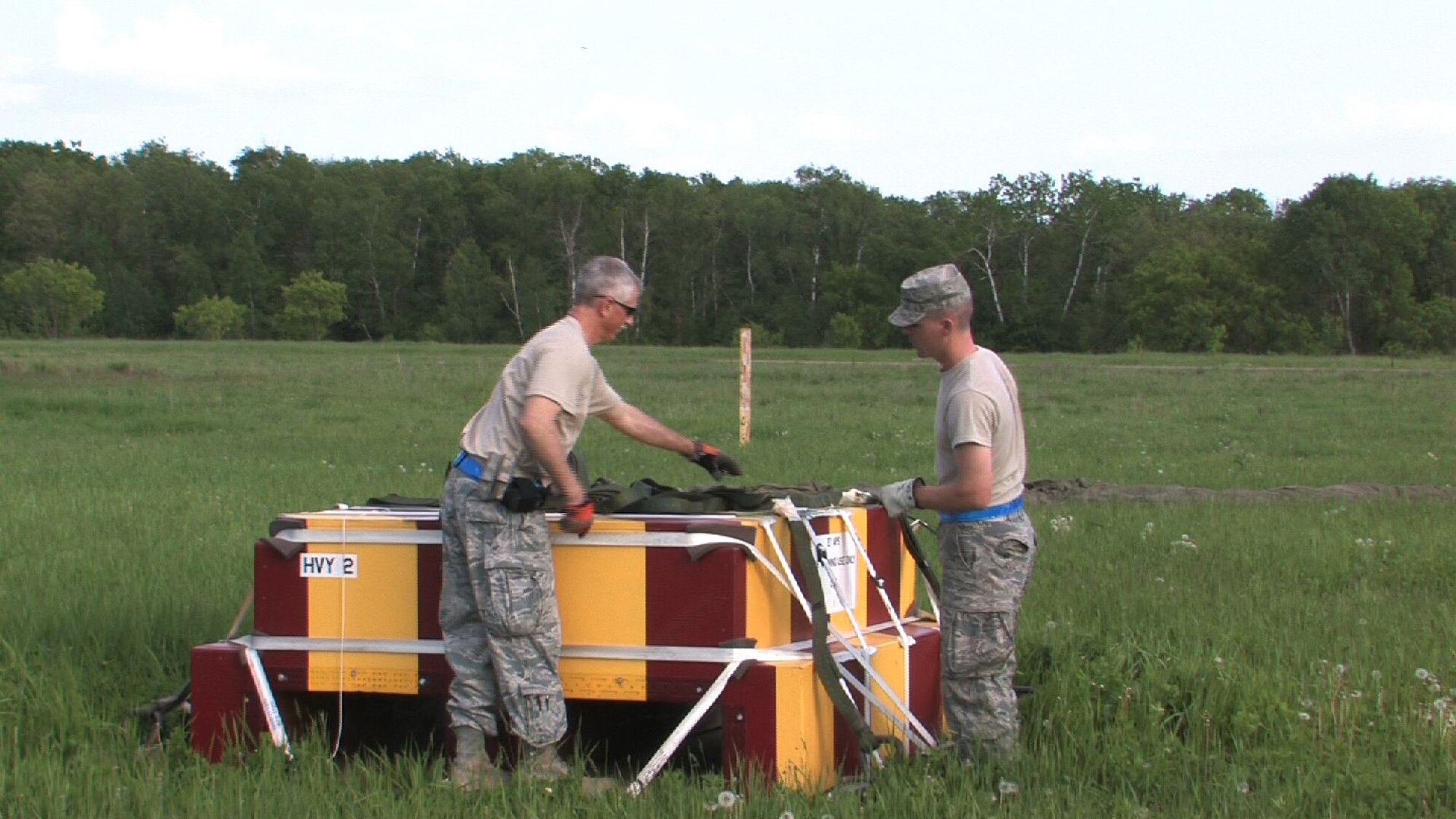 The 934th Airlift Wing conducts Inproved Container Delivery System training at the Arno Drop Zone at Camp Ripley, Minn. (Air Force Photo/Wendy Cormier) 