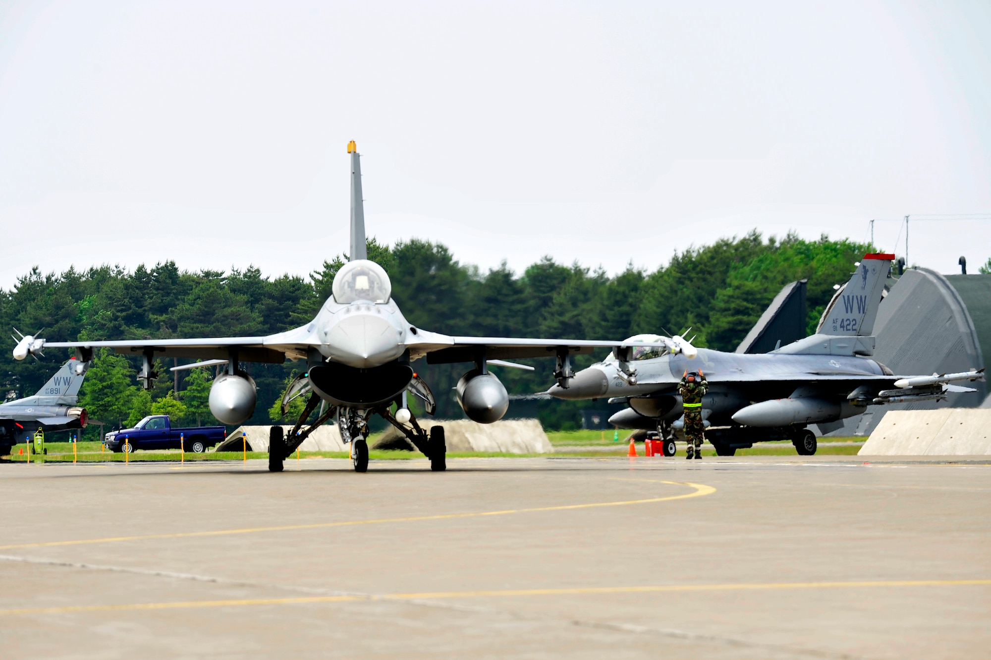 MISAWA AIR BASE, Japan -- F-16 Fighting Falcons taxi to the runway during an exercise, June 22. The 35th Fighter Wing is engaged in a week-long exercise, simulating a variety of scenarios in a combat environment. (U.S. Air Force photo/Staff Sgt. Nathan Lipscomb)