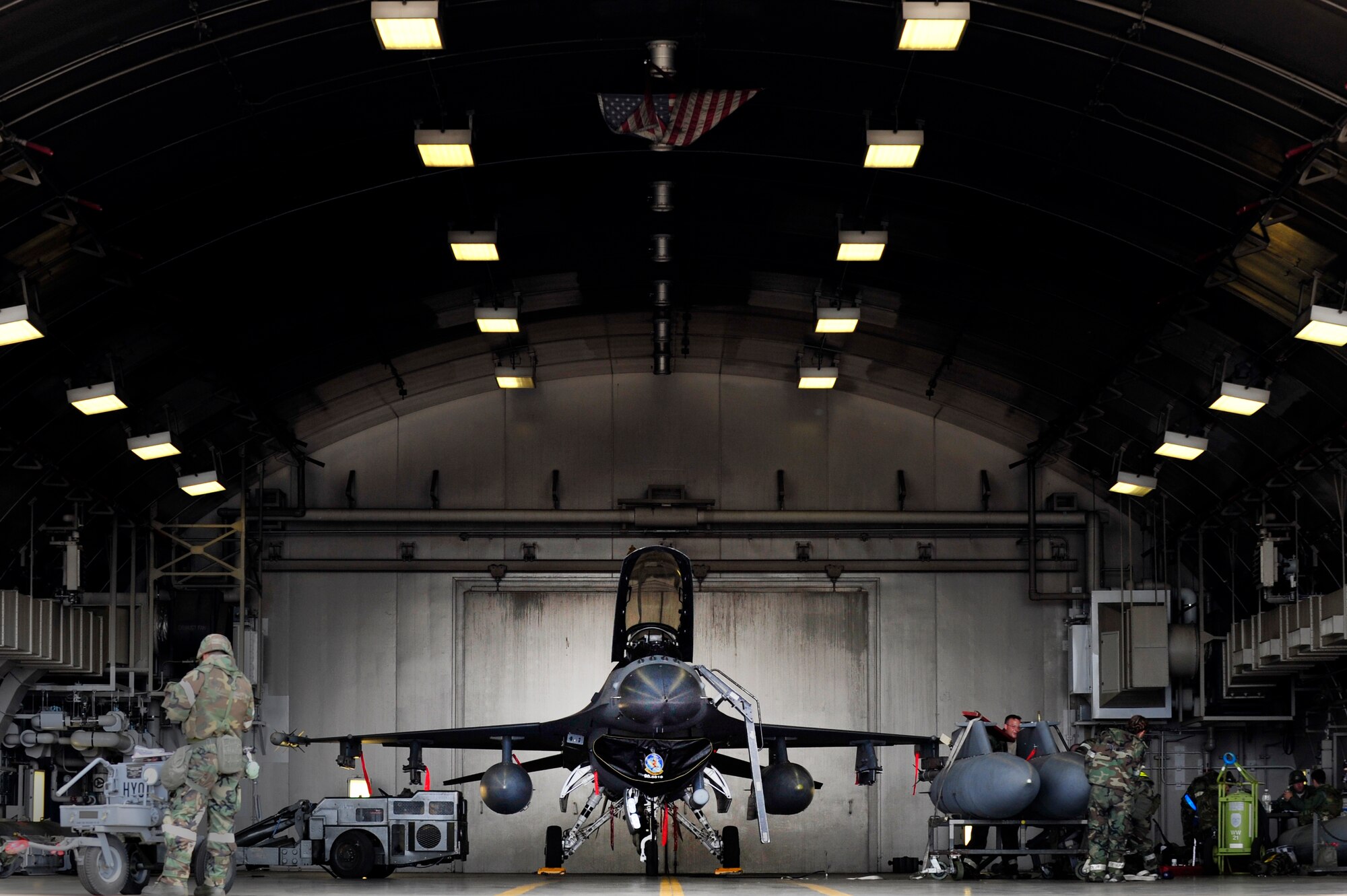 MISAWA AIR BASE, Japan -- Airmen from the 14th Aircraft Maintenance Unit prepare an F-16 Fighting Falcon for flight during an exercise, June 22. The 35th Fighter Wing is engaged in a week-long exercise, simulating a variety of scenarios in a combat environment. (U.S. Air Force photo/Staff Sgt. Nathan Lipscomb)