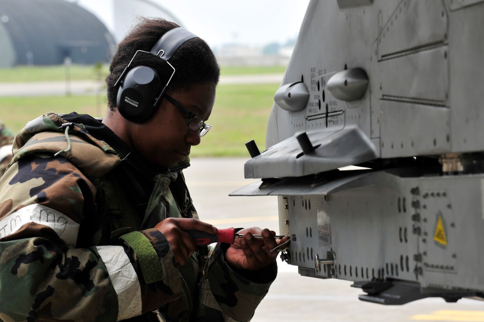MISAWA AIR BASE, Japan -- Senior Airman Alexia Bailey, 14th Aircraft Maintenance Unit weapons loader, prepares an F-16 Fighting Falcon for weapons systems during an exercise, June 22. The 35th Fighter Wing is engaged in a week-long exercise, simulating a variety of scenarios in a combat environment. (U.S. Air Force photo/Staff Sgt. Nathan Lipscomb)