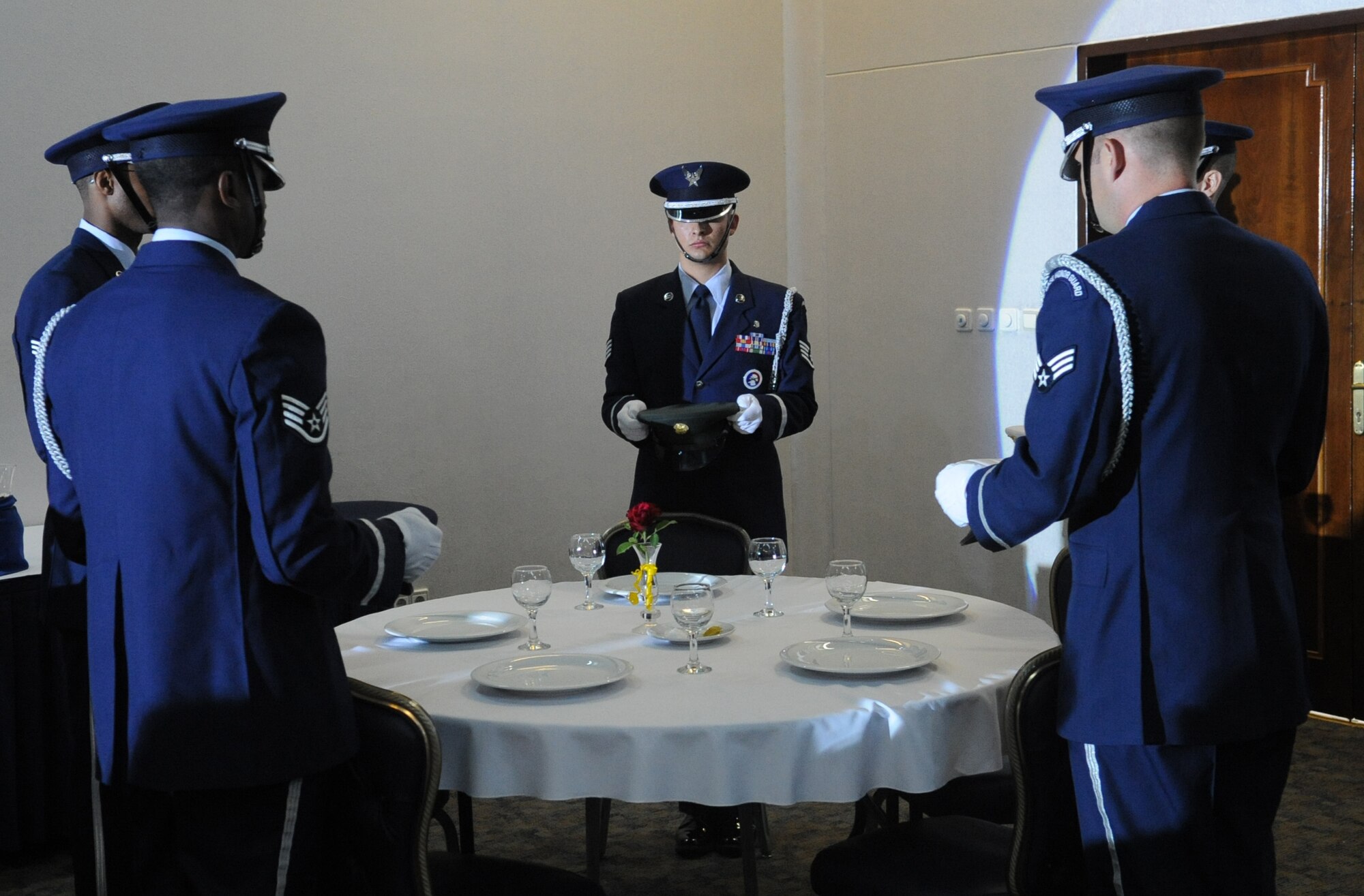 Members of the Incirlik Air Base Honor Guard perform a Prisoner of War/Missing in Action Ceremony during the 39th Air Base Wing Dining Out June 16, 2011, at the Club Complex Ballroom, Incirlik Air Base, Turkey.  (U.S. Air Force photo by Airman 1st Class Clayton Lenhardt/Released)
