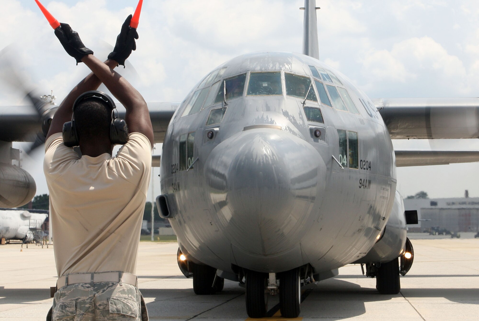 Lt. Col. Soto rolls up for the last time the C-130 Hercules he has been accustom to piloting while assigned to Dobbins June 20. (U.S. Air Force Photo/Don Peek)