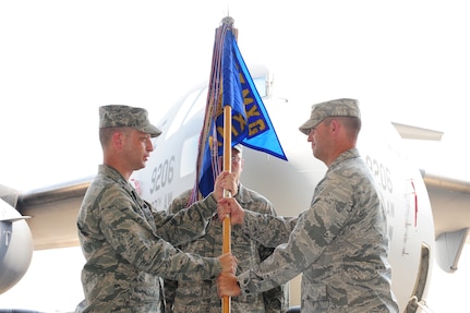 Maj. Ryan White accepts the 437th Aircraft Maintenance Squadron guidon from Col. James Clavenna at the 437 AMXS Change of Command June 21 at Joint Base Charleston. Major White is the new 437 AMXS commander and Col. Clavenna is the 437th Maintenance Group Commander. (U.S. Air Force photo/ Tech. Sgt. Chrissy Best)
