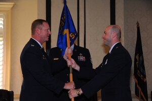 Lt. Col. Danny Davis accepts the 628th Force Support Squadron guidon from Col. Benjamin Wham at the 628 FSS Change of Command June 21 at Joint Base Charleston. Colonel Davis is the new 628 FSS Commander and Colonel Wham is the 628th Mission Support Group Commander. (U.S. Air Force photo/ Tech. Sgt. Chrissy Best)
